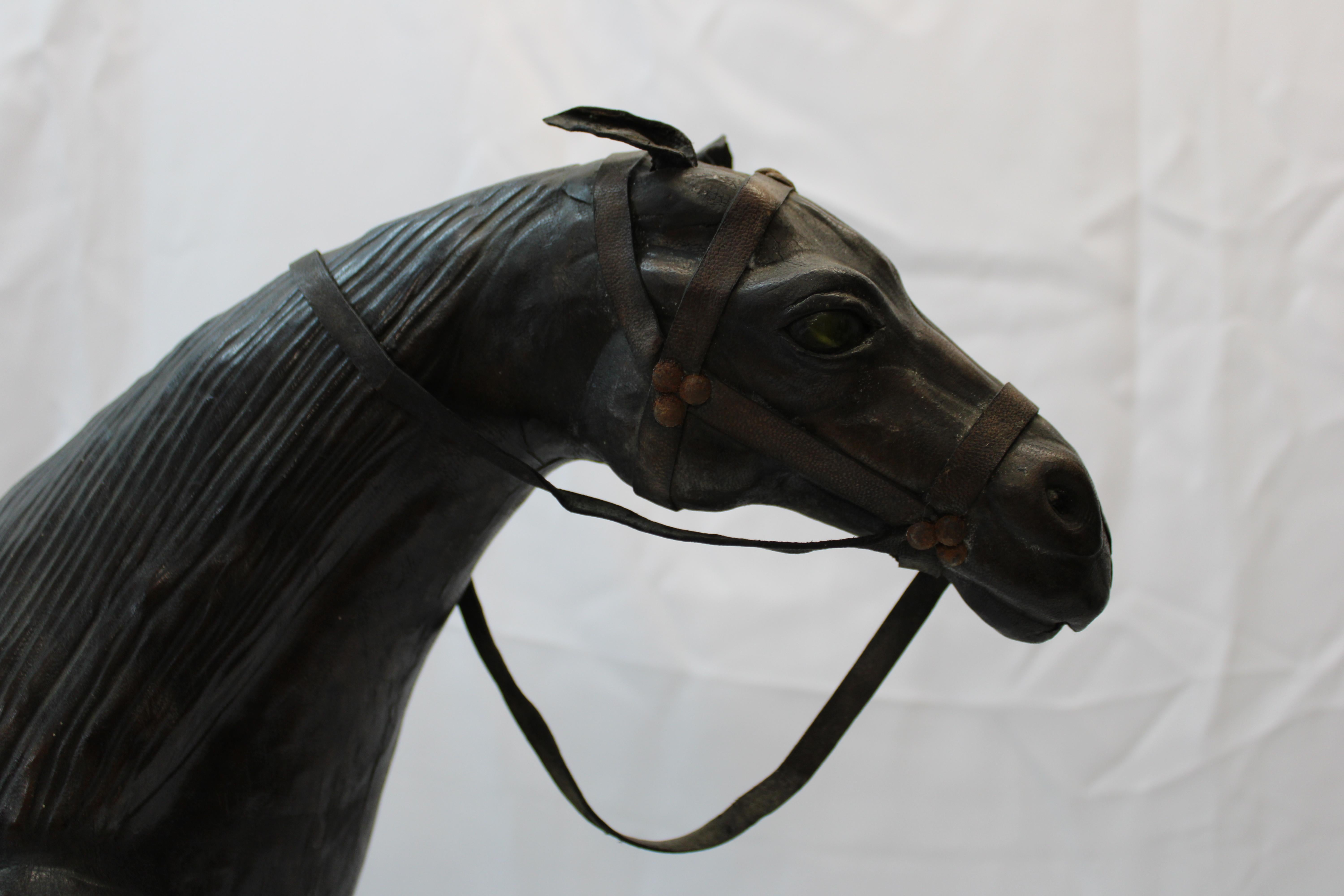 Handmade French leather horse and saddle with glass eyes.