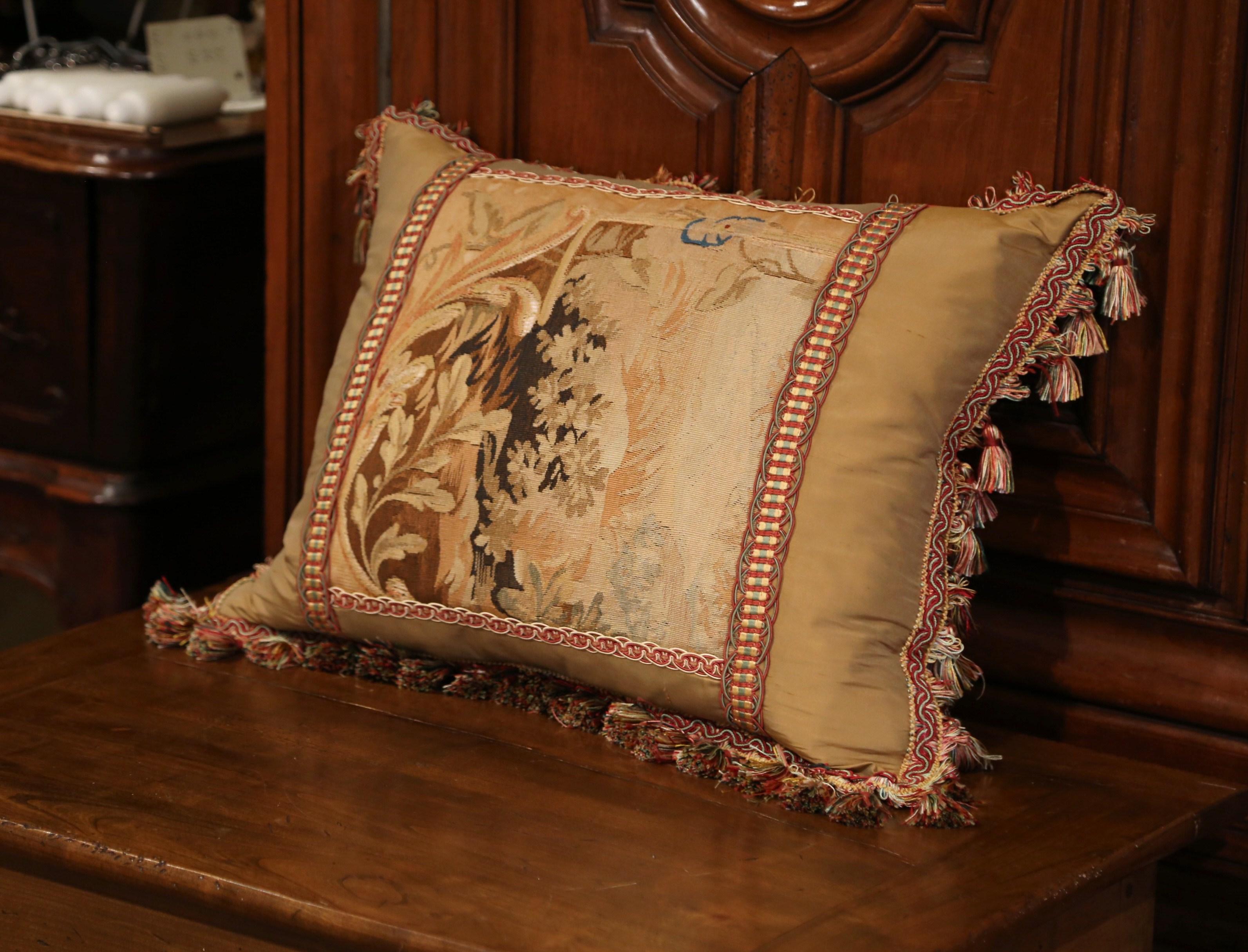 Decorate a bed or living room couch with this custom, silk, velvet and antique tapestry pillow. The rectangular, plush pillow is made from scratch using an antique Aubusson verdure tapestry fragment decorated with floral and foliage decor. The plush