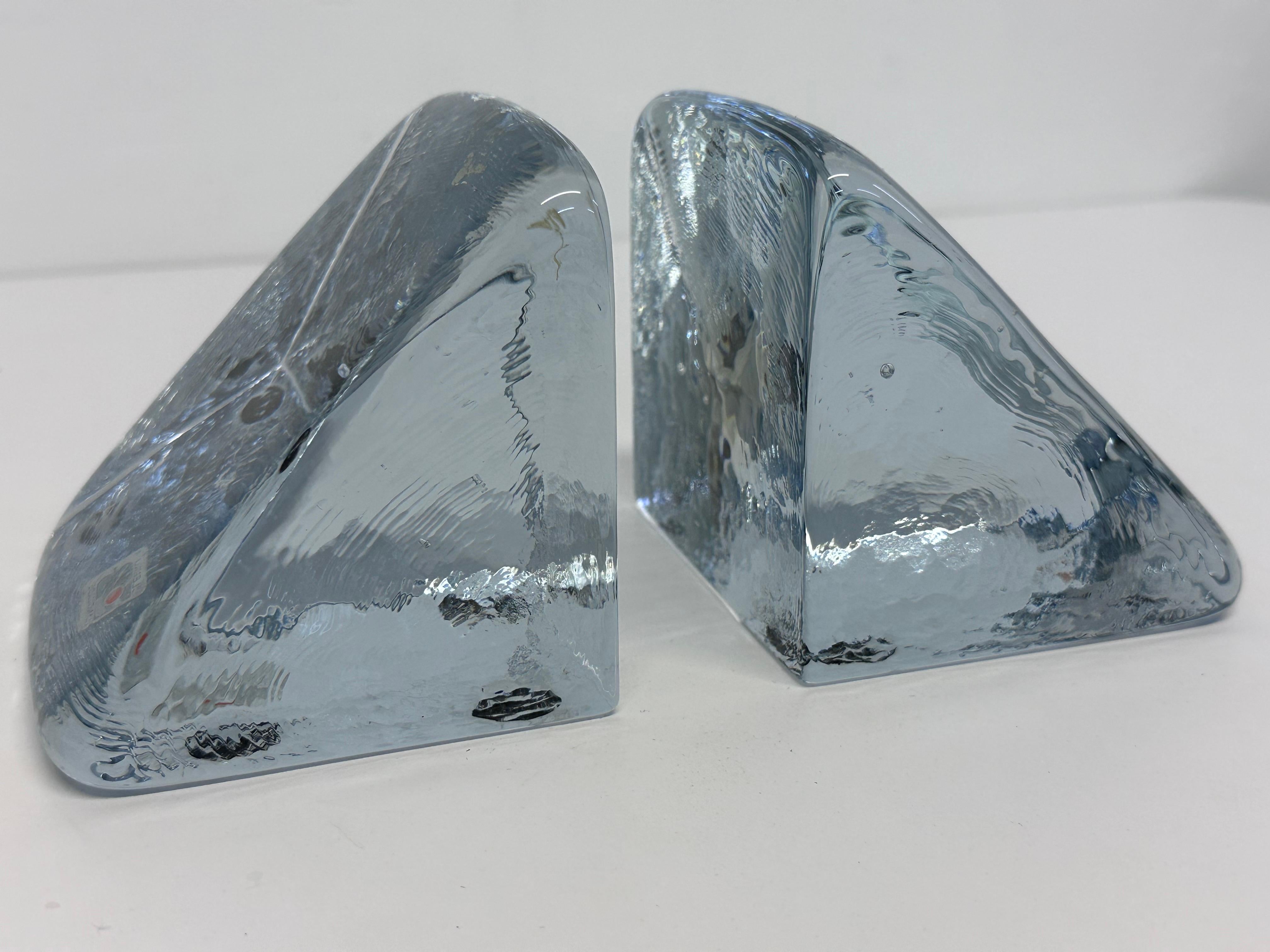 Pair of handmade glass bookends with smooth top and textured sides by Blenko Glass, USA circa 1980s.

Measurement for each block: w3.5