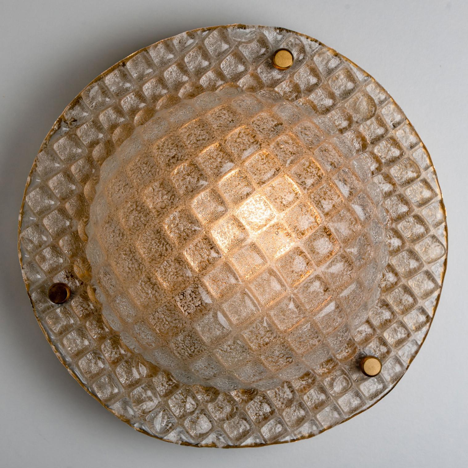 1 of the 2 high quality modern thick diamond textured glass flush mount. Manufactured by Hillebrand, Germany around 1970.
The flush mount features an impressive huge round handmade glass dish. With a brass back plate. Can also work as an impressive