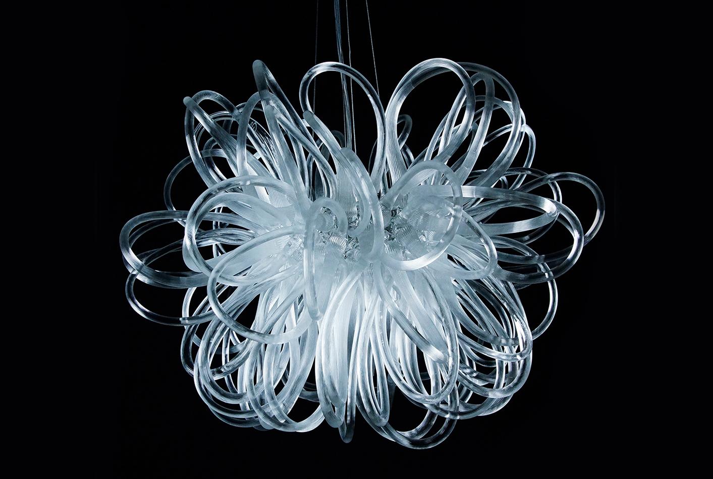 Contemporary chandelier by glass artist Rike Scholle.

Each loop of the pendant light is made individually by hand in Bavaria. 