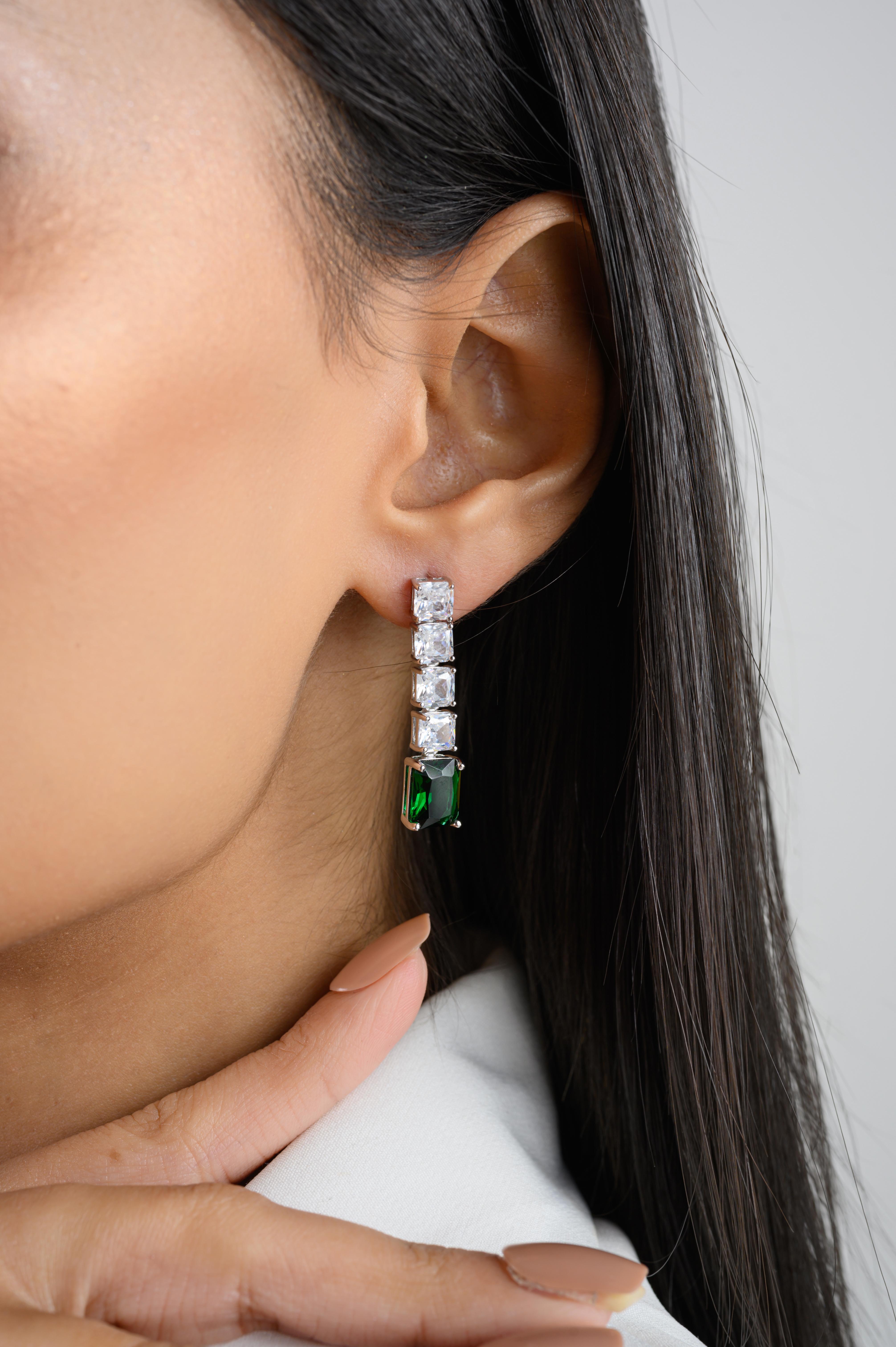 Handmade Green Zirconia Linear Drop Earrings in sterling silver. You shall need these statement drop earrings to make a statement with your look. Each piece features dazzling cubic zirconia stones, renowned for their brilliance and clarity, set in