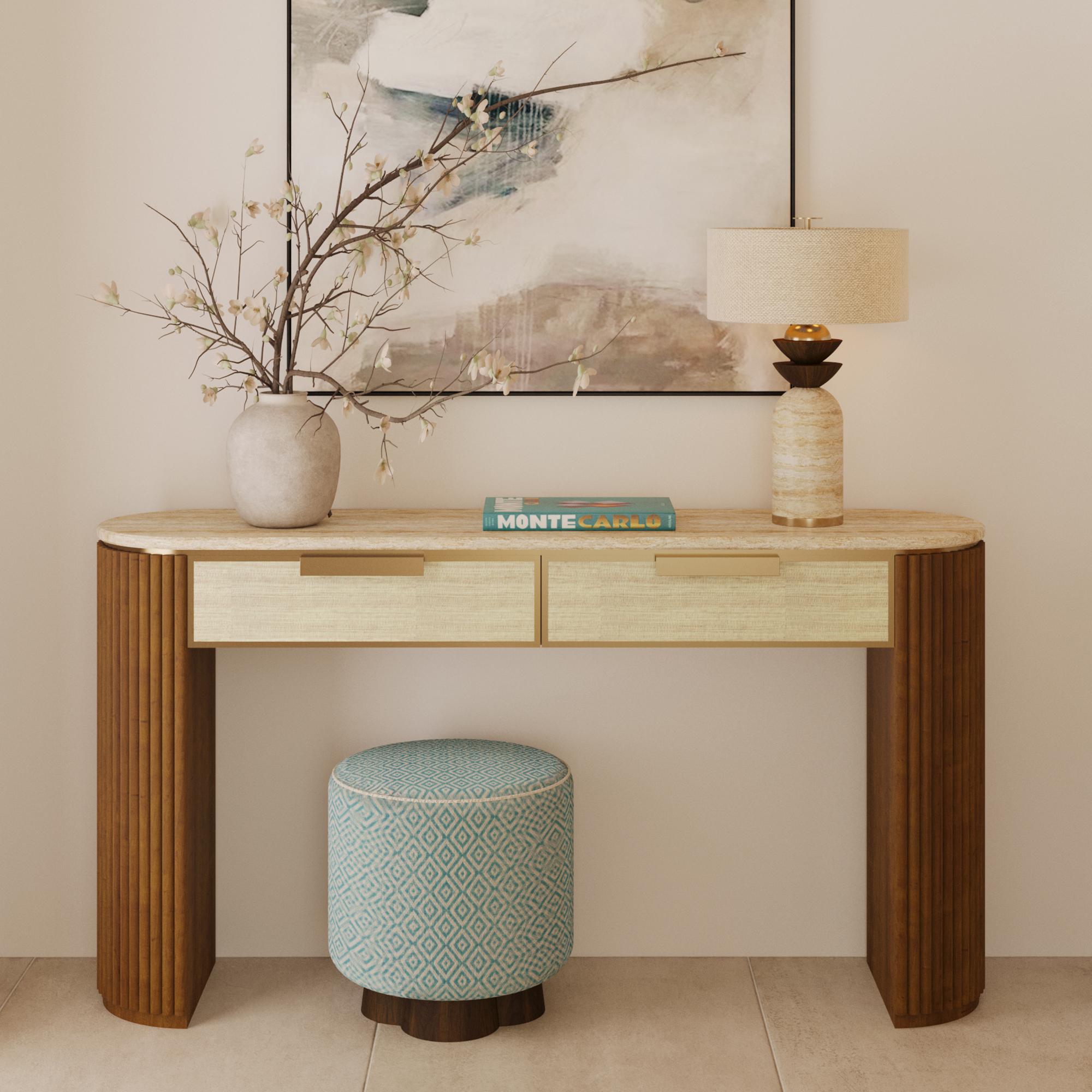 The Gustav table lamp’s harmonious proportions and thoughtful material contrasts make it as much a sculptural centerpiece as a lighting fixture. Its travertine base is hand-cut and polished, revealing unique mineral patterns that ensure no two