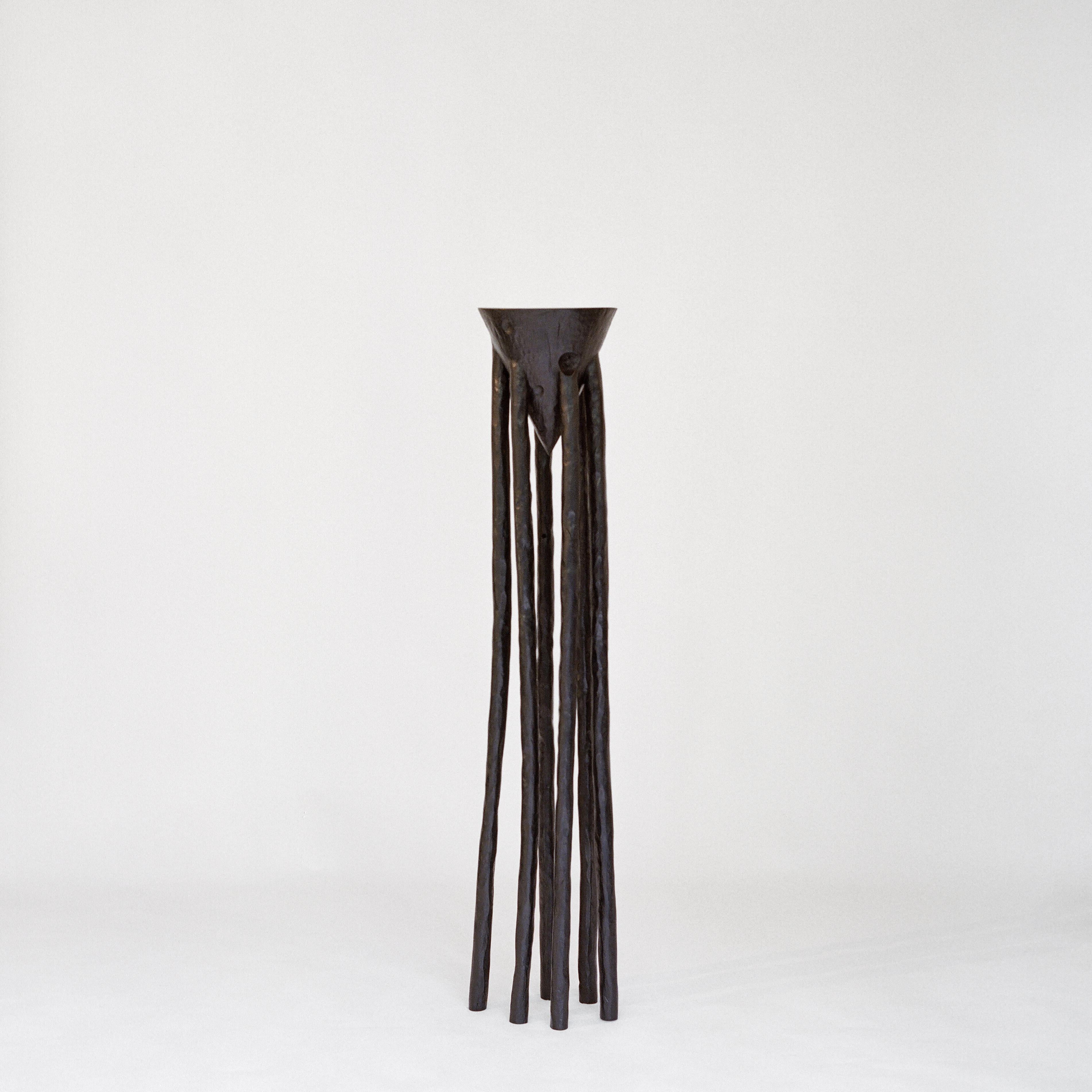 Handmade High Table by Henry D'ath
Dimensions: D 25 x H 135 cm
Materials: Wood, calligraphy ink.

Piece is handmade by artist.

Carved by hand from a single wooden log over many months, this series of tall tables is shaped with a consideration of