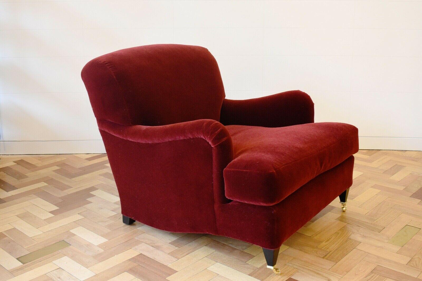 A beautiful handmade Howard style armchair upholstered in a deep red Mohair velvet. 

As well as selling antique and vintage furniture we also offer a small range of handmade pieces.This piece has been handmade in the UK by our team of skilled