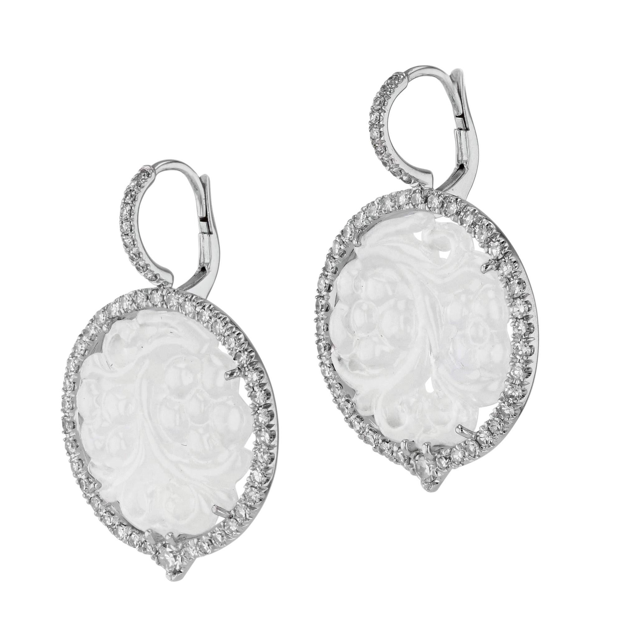 Stunning Icy Jadeite and Diamond Drop Earrings, crafted in luxurious 18kt White Gold, provide an elegant addition to any ensemble. Single Cut Diamonds  surround the 20mm Icy Jadeites and ascend gracefully up the bail.
These would make a spectacular