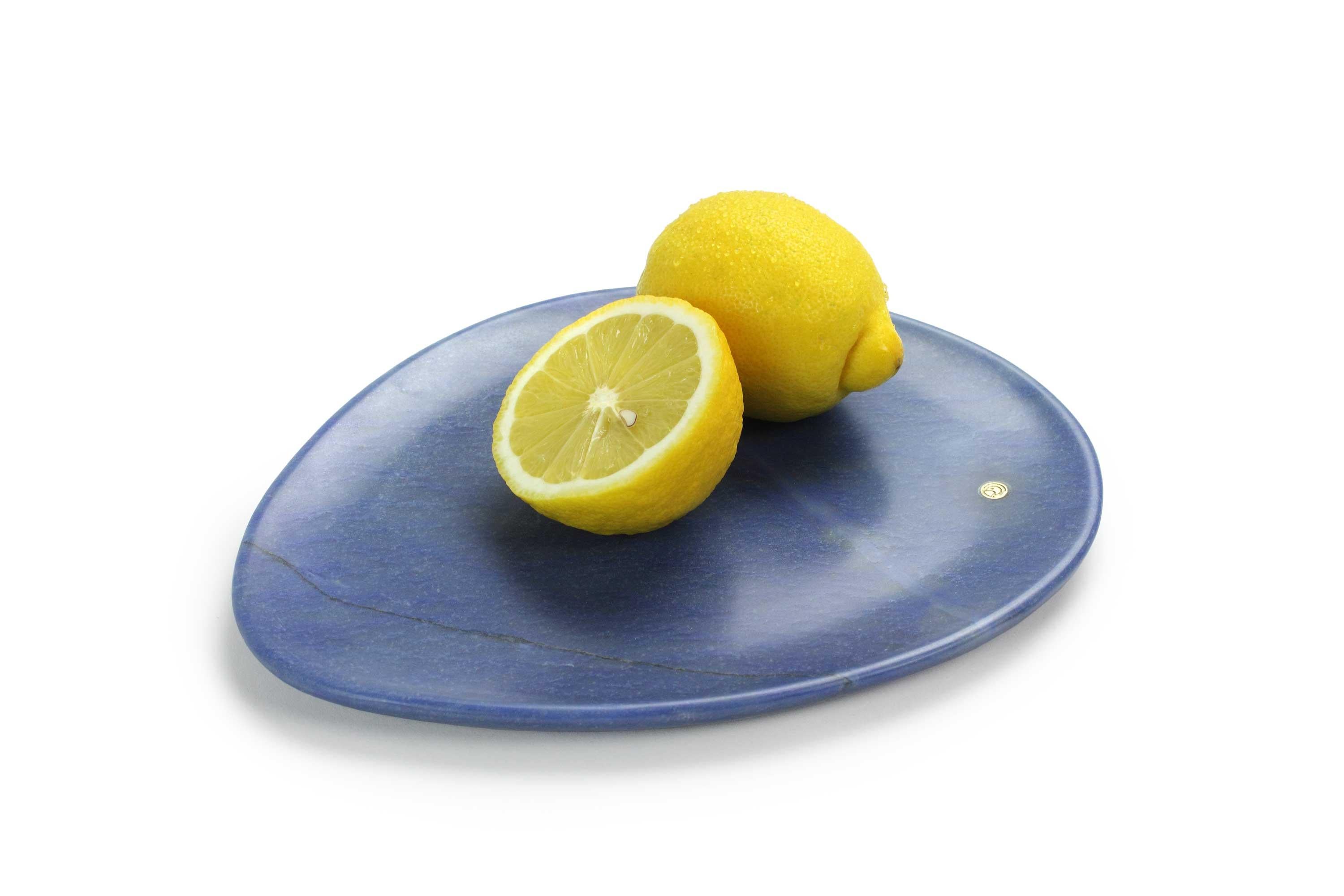 Hand carved presentation plate from semi-precious quartzite Azul Macaubas (Extra Blue).
Multiple use as plates, platters and placers. 

Dimensions: Small L 24, W 20, H 1.8 cm, also available: Medium L 30, W 28, H 1.8 cm, big L 36, W 35, H 1.8