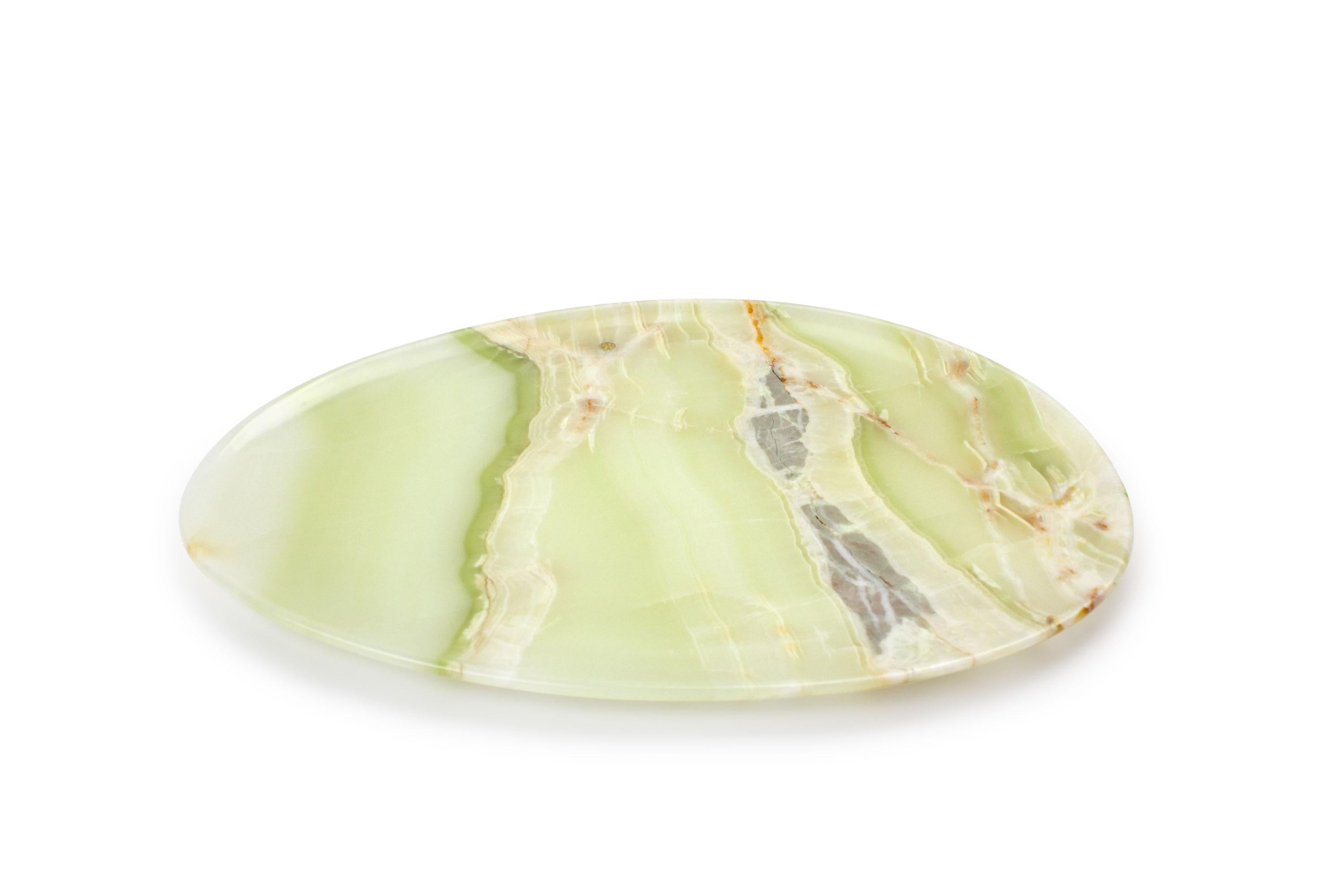 Hand carved presentation plate from Green onyx. Multiple use as plates, platters and placers. The polished finishing underlines the transparency of the onyx making this a very precious object. 

Dimensions: Big L 36, W 35, H 1.8 cm, also available: