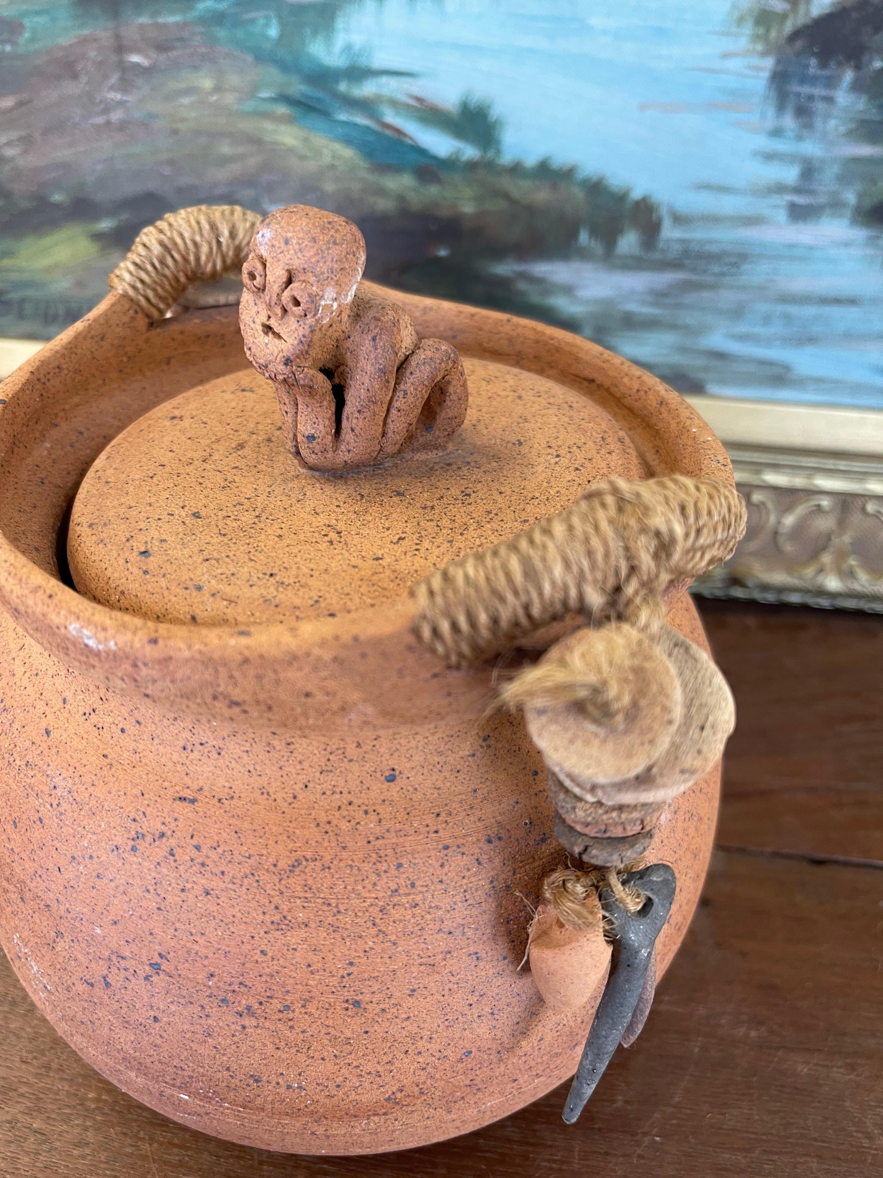 Late 20th Century Handmade Indonesian Terracotta Lidded Jar with Beaded Raffia Accents For Sale