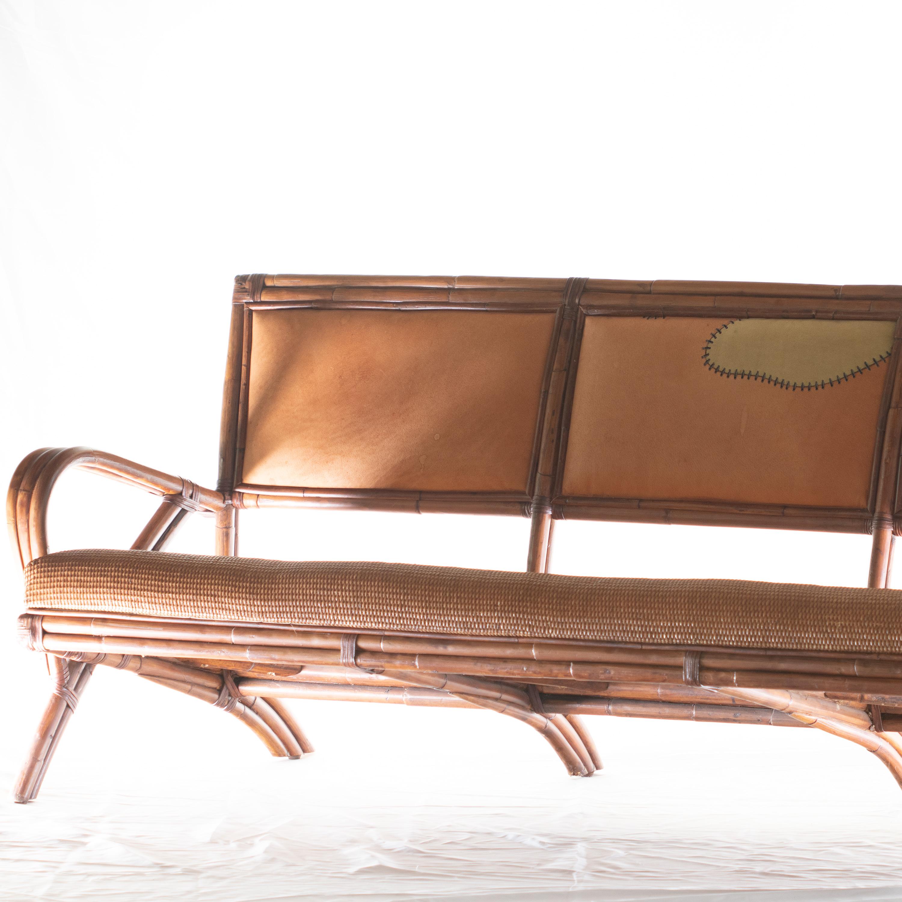 Modern straight and big sofa (4 seats) designed by Ramon Castellano (spanish designer), stamped for Kalma in Bamboo Wood, 20th Century. Collapsible rattan base reinforced with wrought iron. Seat is framed in rattan and crown is in wood. Bindings in