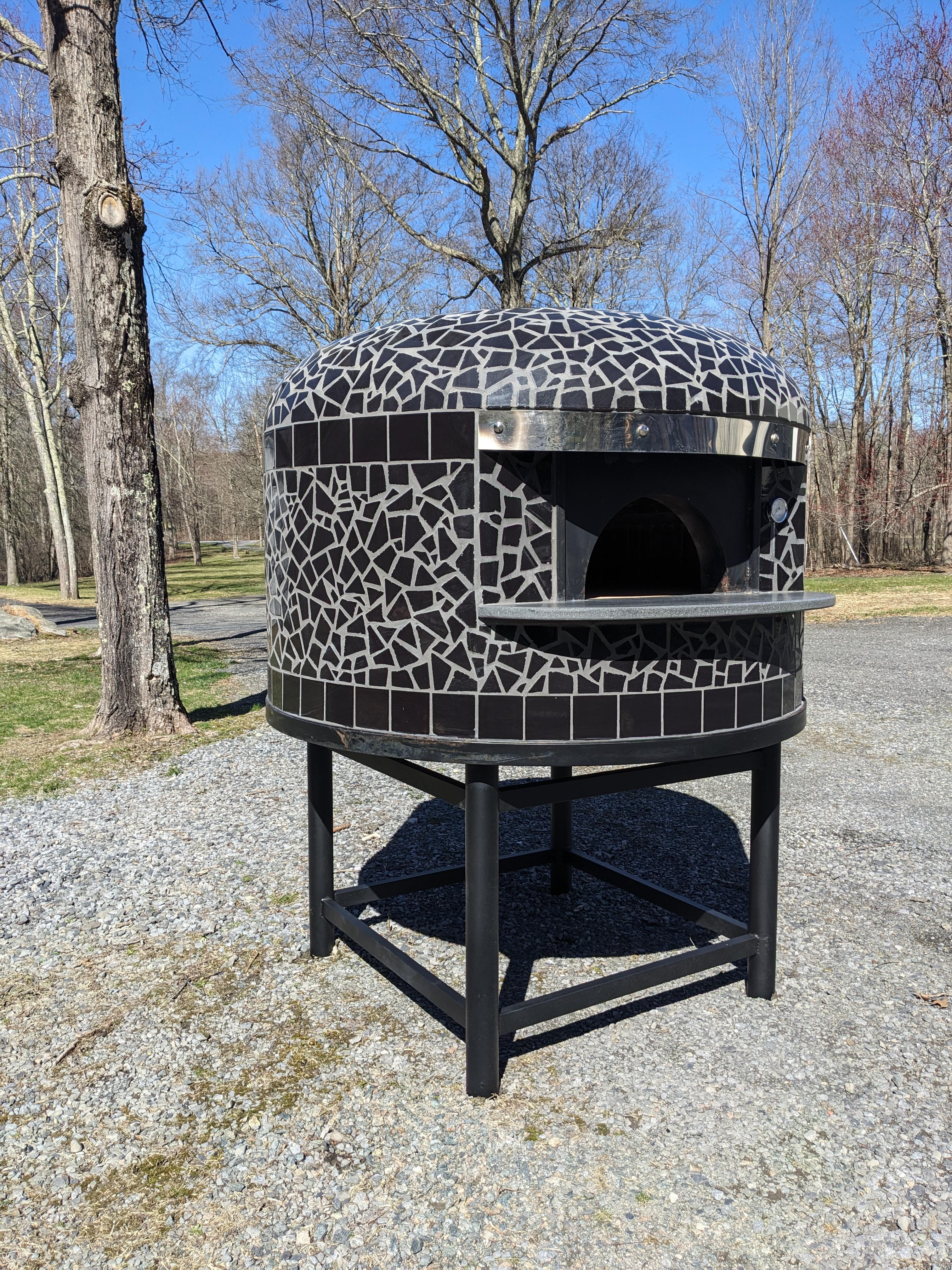 Authentic Neapolitan style wood-fired pizza oven straight from Italy.

Our pizza ovens are handmade by a 3rd-generation oven maker near Naples, Italy using the highest quality materials in the classic Neapolitan oven tradition.

The classic brick