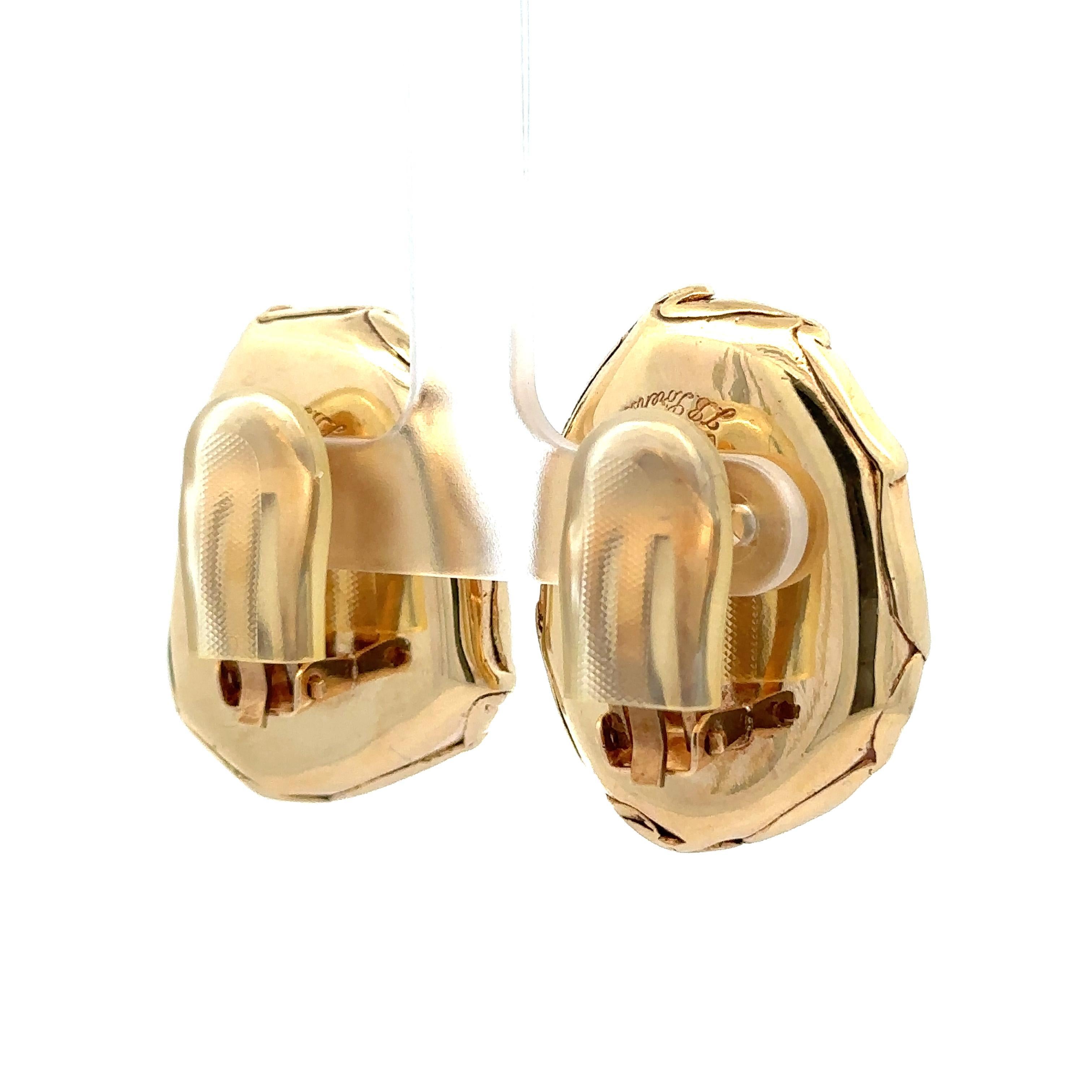 –Stone(s)–
(2) Natural Genuine Amber - Freeform Shape- Bezel Set - Custom Frame - Brown Color - 30.2x23.2mm each (approx.)

Material: Solid 14k Yellow Gold w/ Rubber Backings
Weight: 21.26 Grams (without the rubber backings)
Backing: Clip On