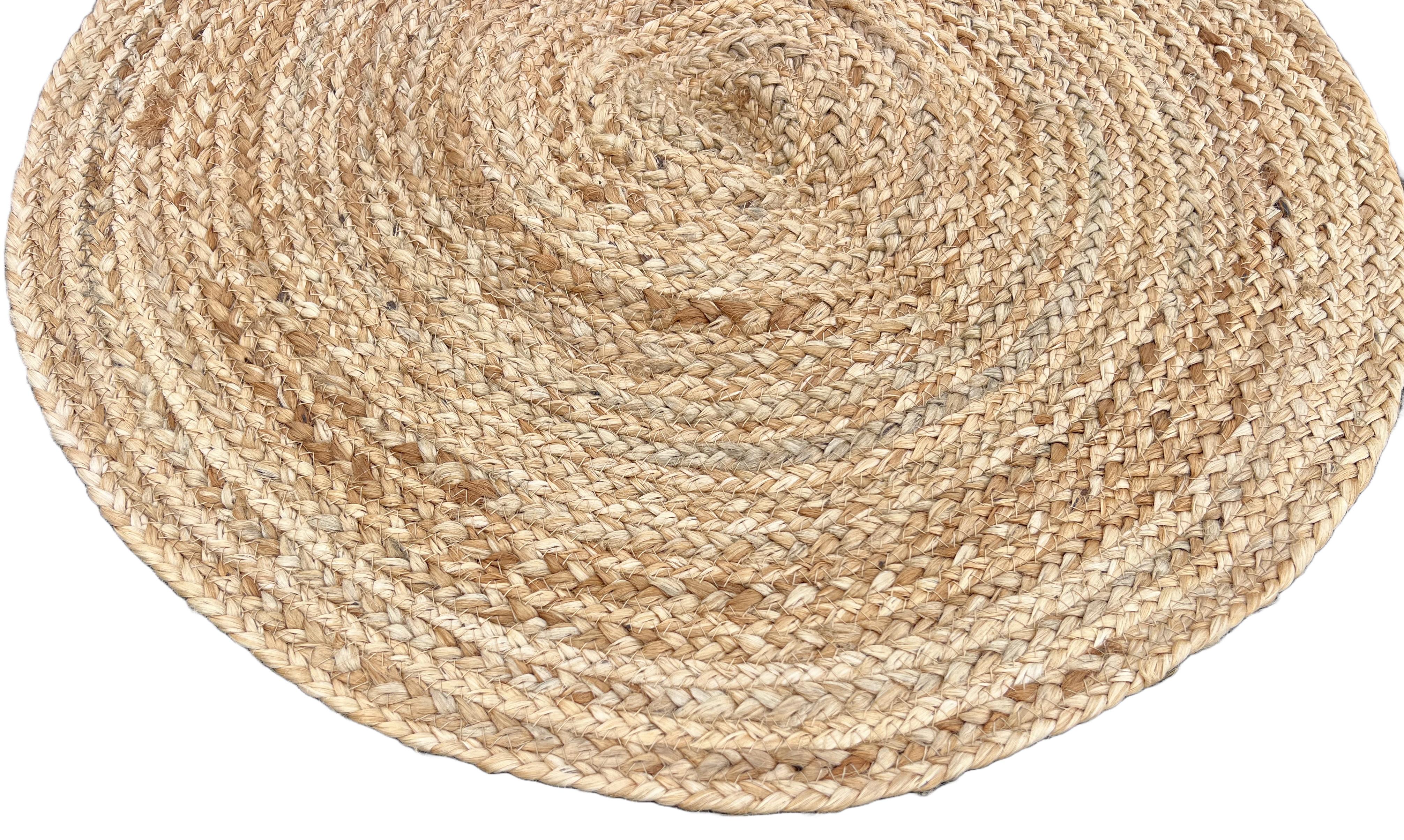Handmade Jute Round Rug, Natural Jute Dhurrie -2' Día (60cm Dia)

These special flat-weave dhurries are hand-woven with 15 ply 100% cotton yarn. Due to the special manufacturing techniques used to create our rugs, the size and color of each piece
