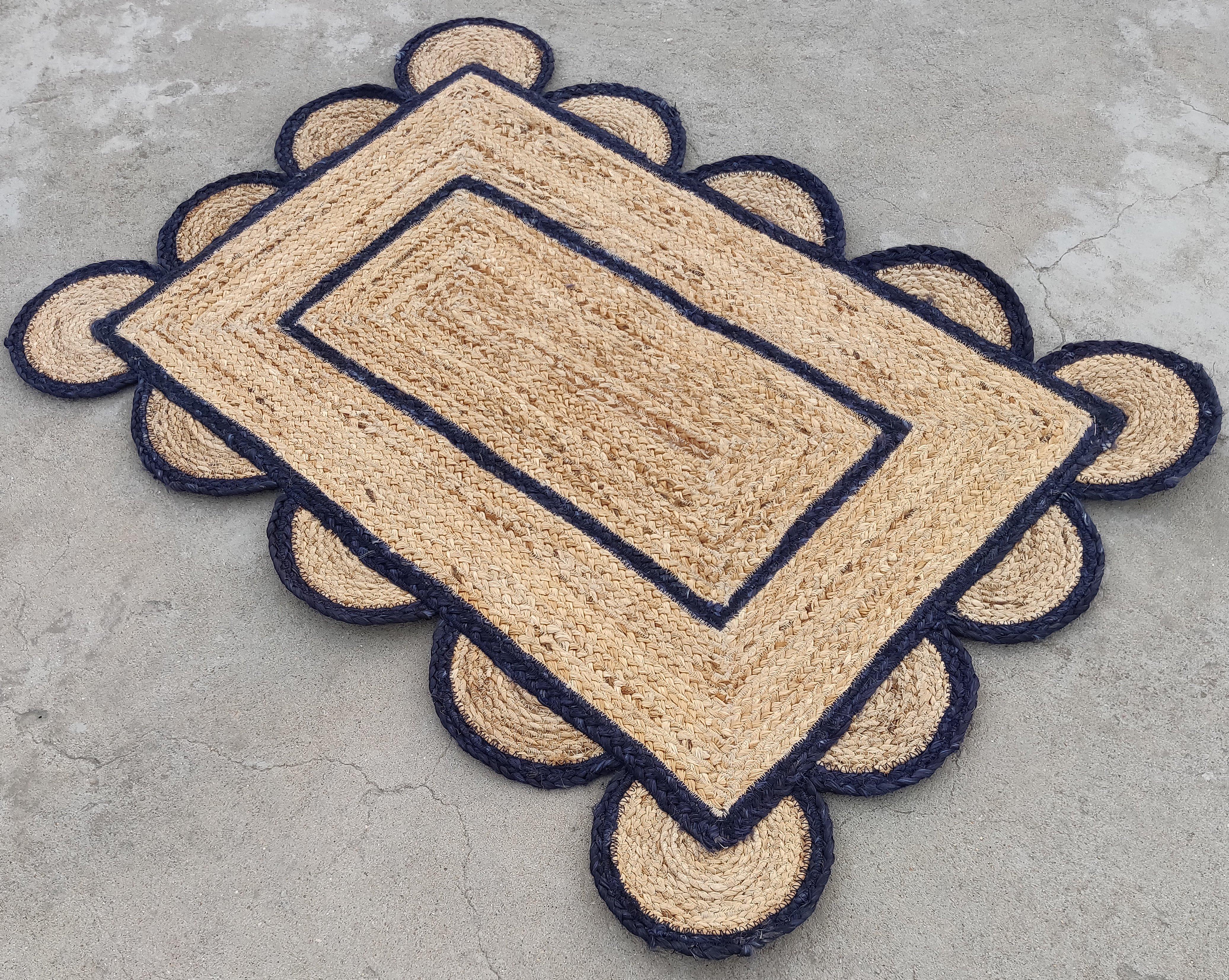 Handmade Jute Scalloped Rug, Natural Jute Dhurrie with Navy Blue Border -2'x3'

These special flat-weave dhurries are hand-woven with 15 ply 100% cotton yarn. Due to the special manufacturing techniques used to create our rugs, the size and color of