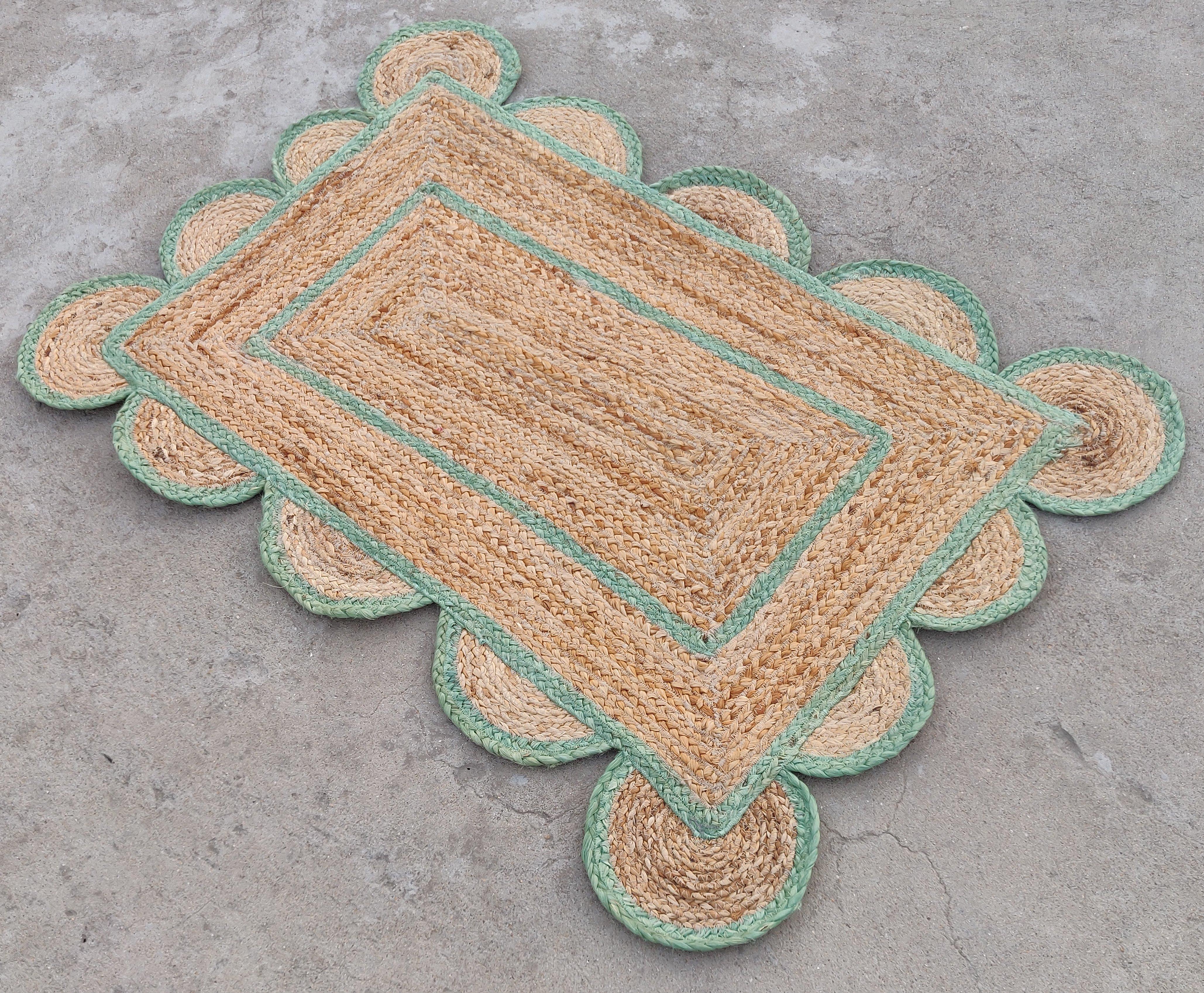 Handmade Jute Scalloped Rug, Natural Jute Dhurrie with Green Border -2'x3'

These special flat-weave dhurries are hand-woven with 15 ply 100% cotton yarn. Due to the special manufacturing techniques used to create our rugs, the size and color of