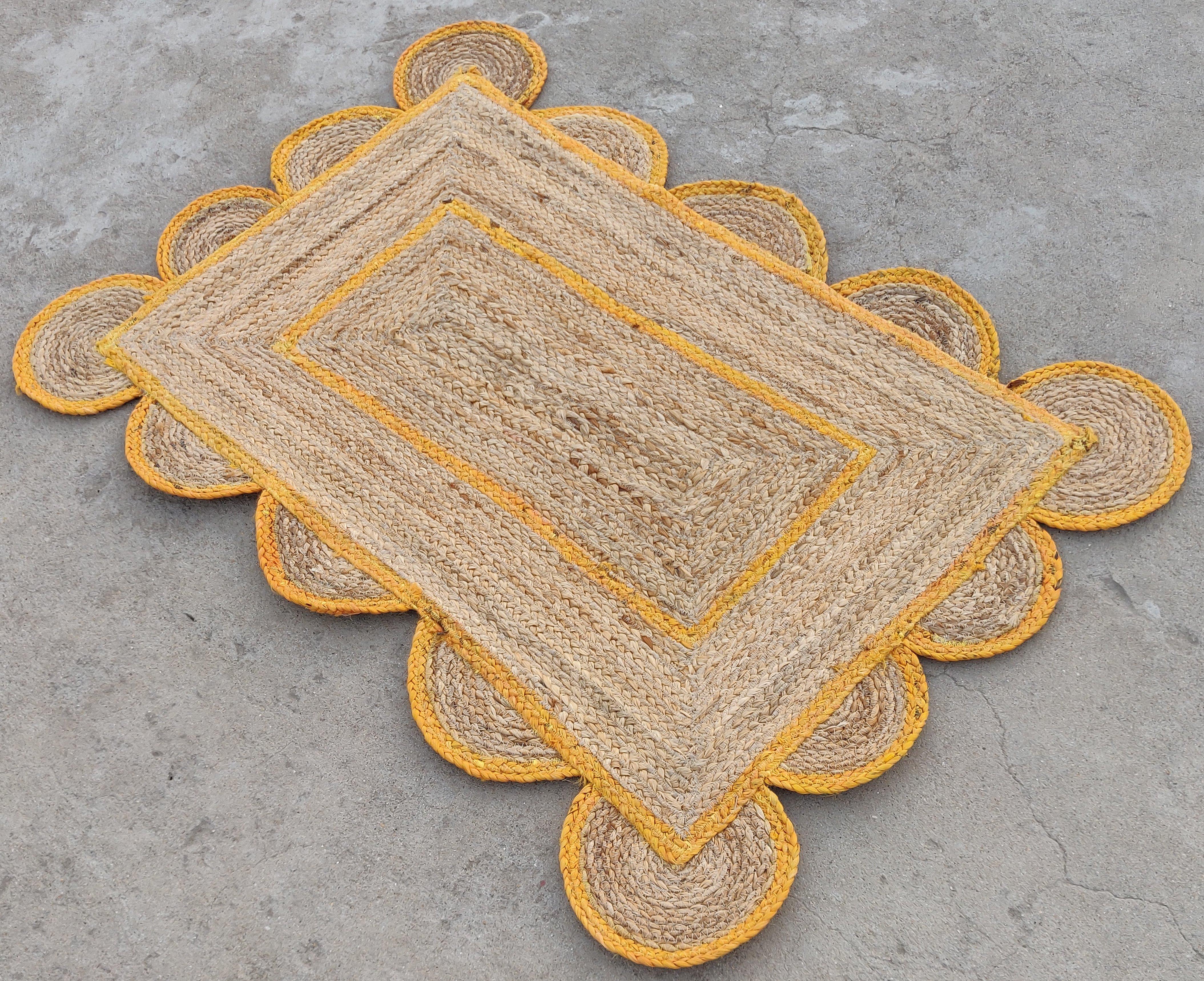 Handmade Jute Scalloped Rug, Natural Jute Dhurrie with Orange Border -2'x3'

These special flat-weave dhurries are hand-woven with 15 ply 100% cotton yarn. Due to the special manufacturing techniques used to create our rugs, the size and color of