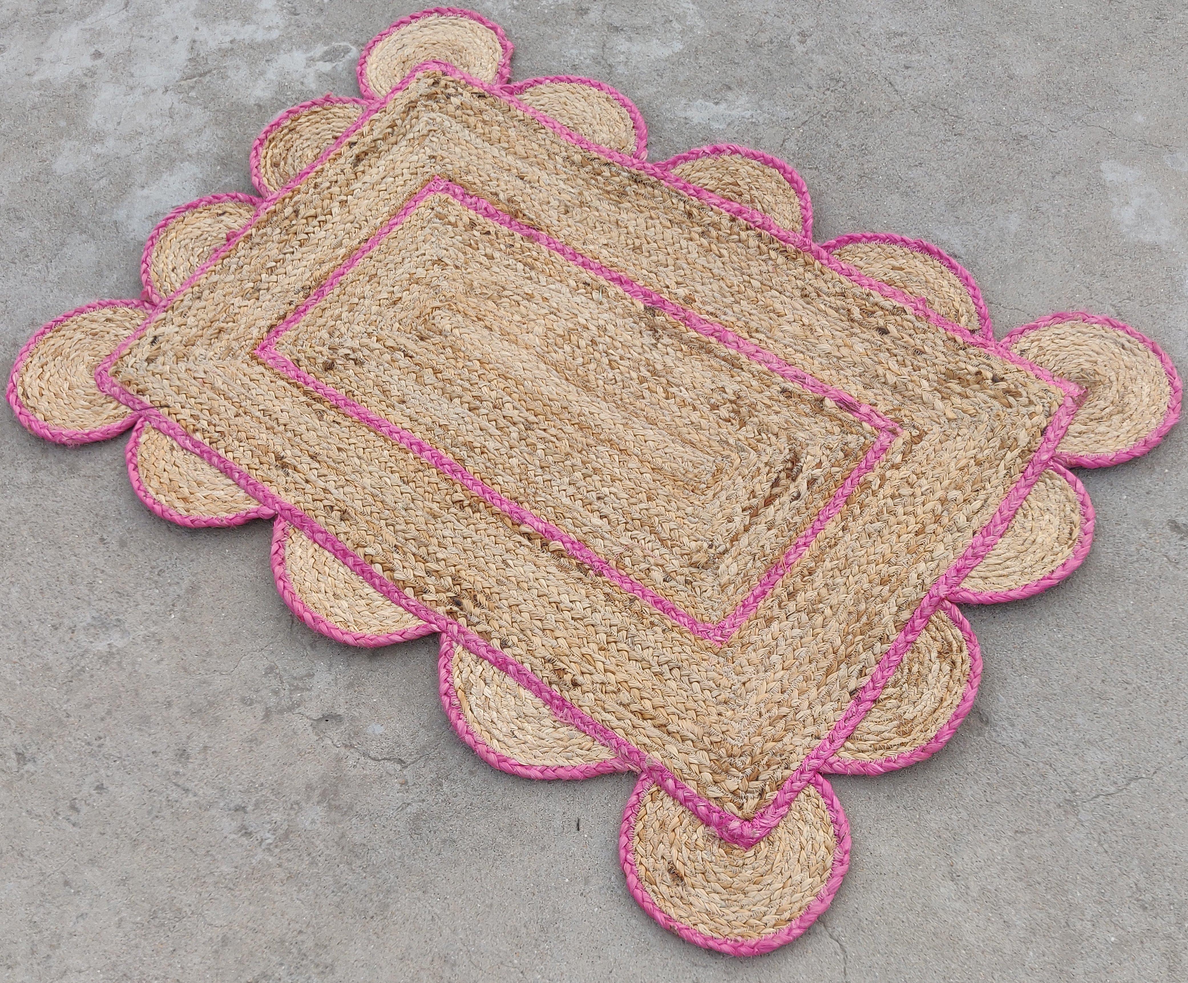 Handmade Jute Scalloped Rug, Natural Jute Dhurrie with Pink Border -2'x3'

These special flat-weave dhurries are hand-woven with 15 ply 100% cotton yarn. Due to the special manufacturing techniques used to create our rugs, the size and color of each