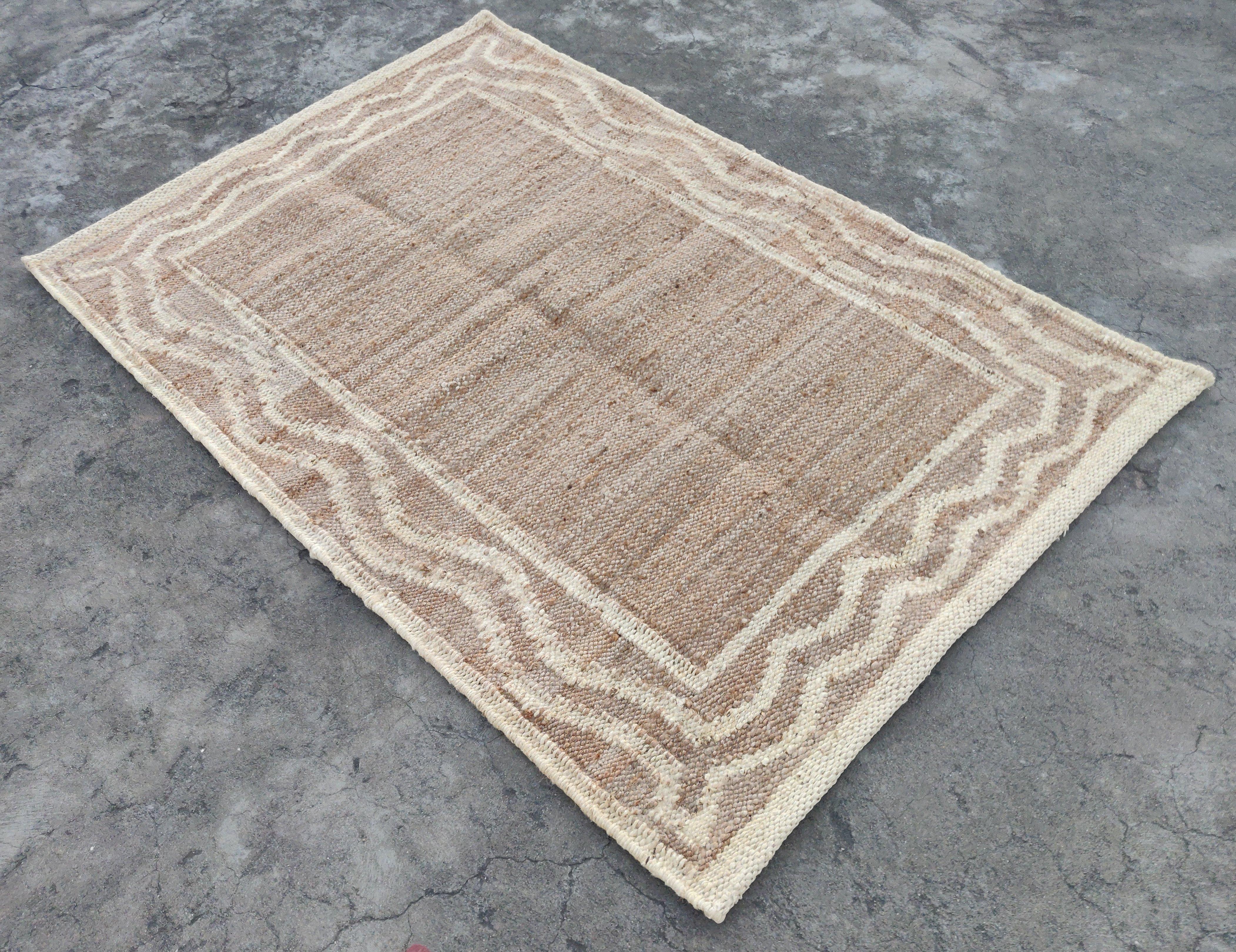 Handmade Jute Bordered Rug, Natural Jute And Antiqued White Bordered Indian Dhurrie -4'x6'

These special flat-weave dhurries are hand-woven with 15 ply 100% cotton yarn. Due to the special manufacturing techniques used to create our rugs, the size