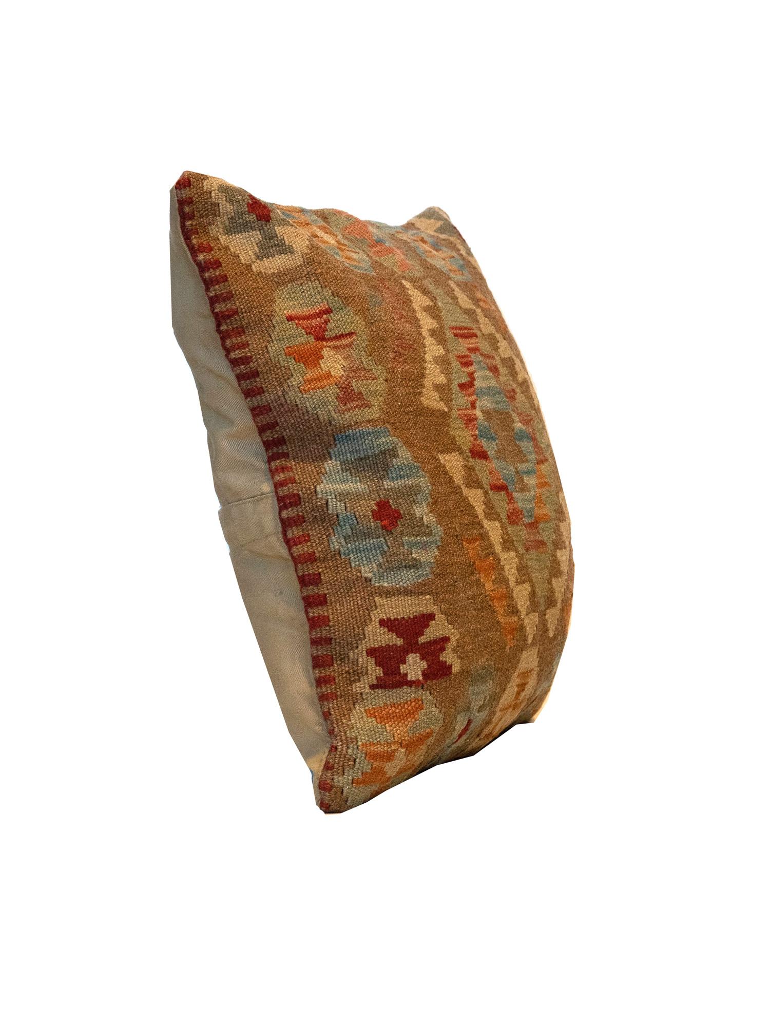 This traditional Kilim cushion cover has been handwoven with the traditional Kilim, flat-weave technique. Featuring a geometric pattern woven in beige, cream, blue and green. Decorate your bed, sofa or armchair with this fantastic piece as a scatter