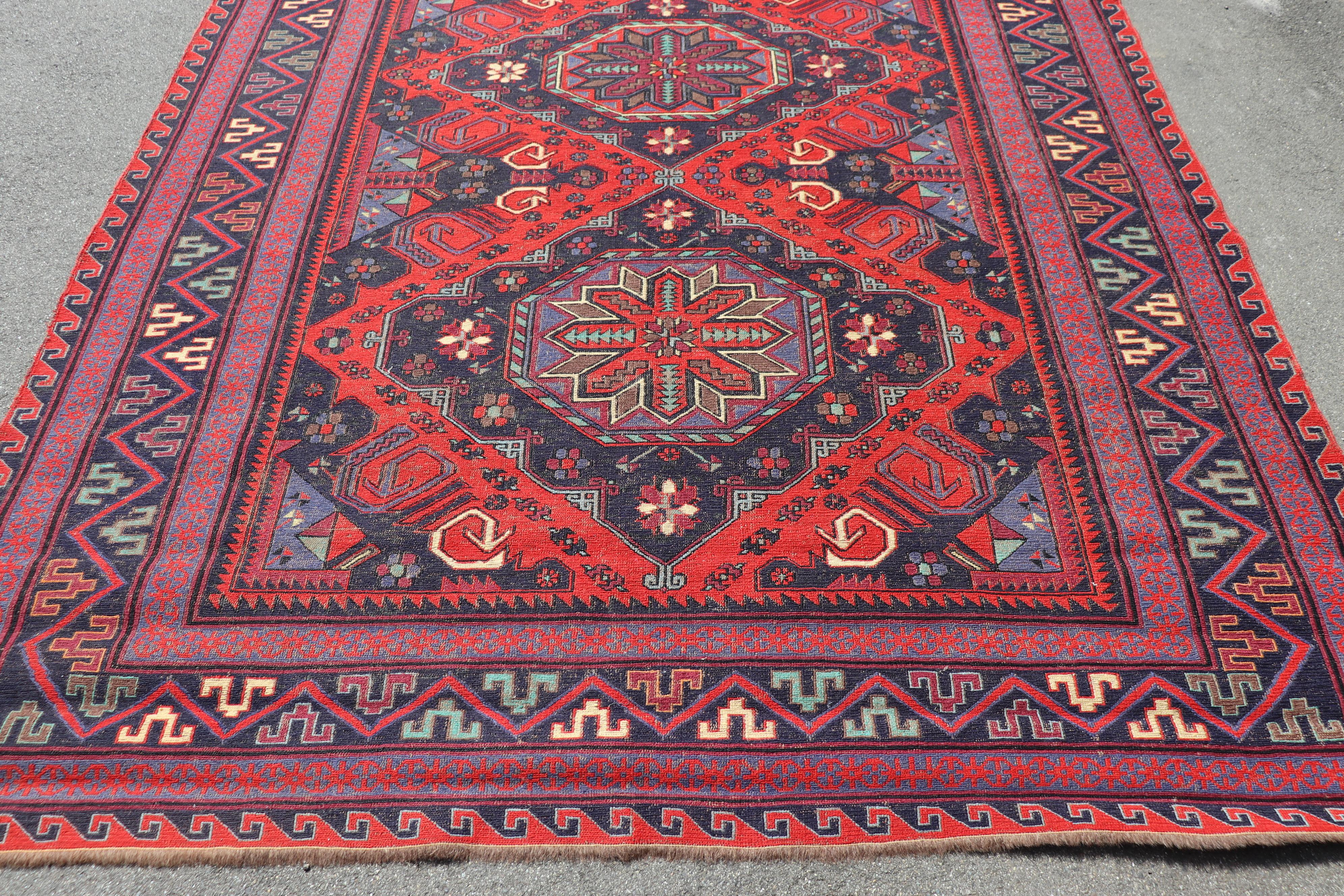 Beautiful early 20th century ( 1930s circa)  persian shiraz large rug handmade in wool. This fantastic rug it is in the main color red with a motif of central medallions with blue background. Used conditions.
   