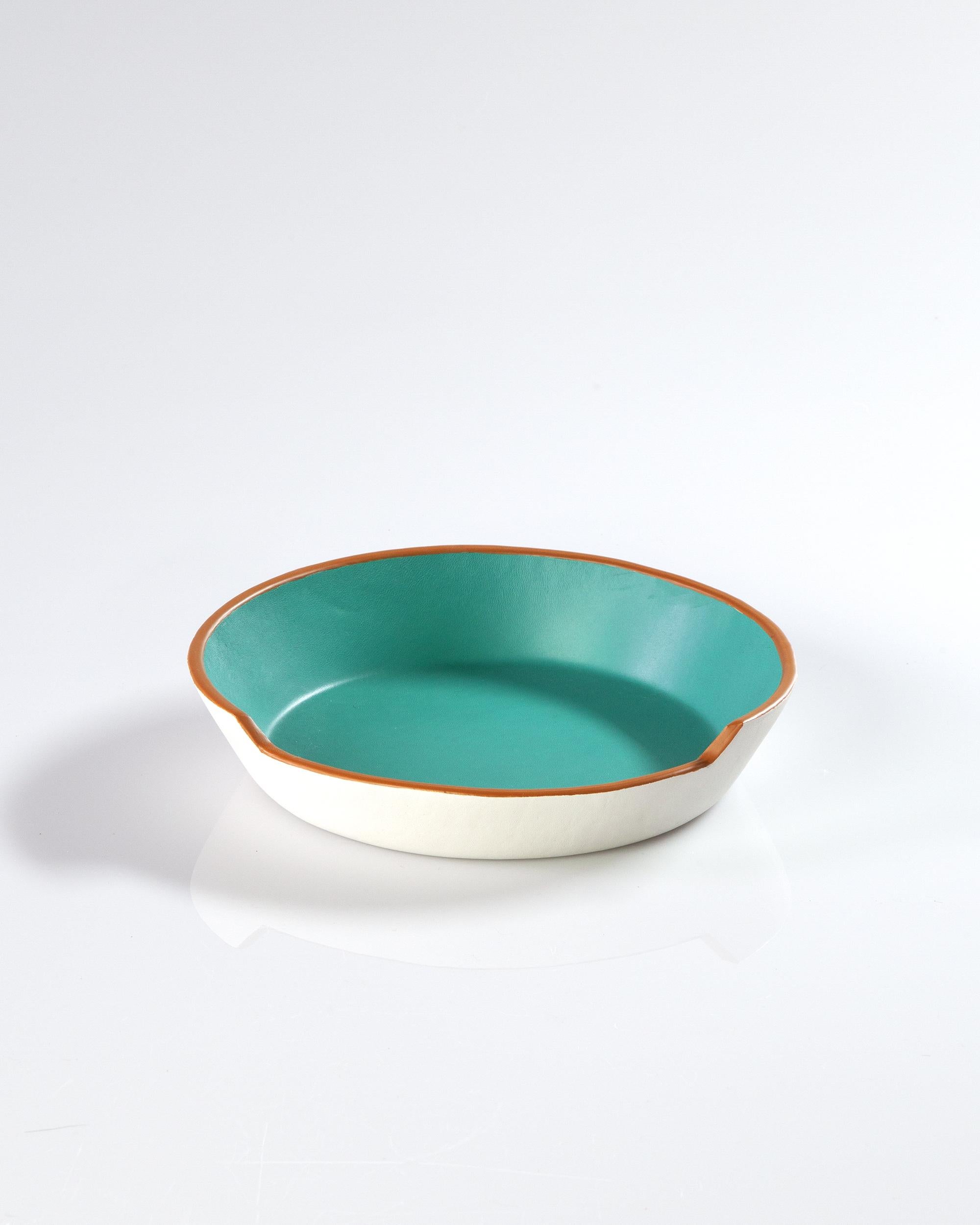 This handmade leather bowl in aqua and white is the perfect addition to complete your dining room table or any room in your home. Rustic charm meets contemporary handcrafted design sensibility in this exquisite bowl. Featuring a unique asymmetrical