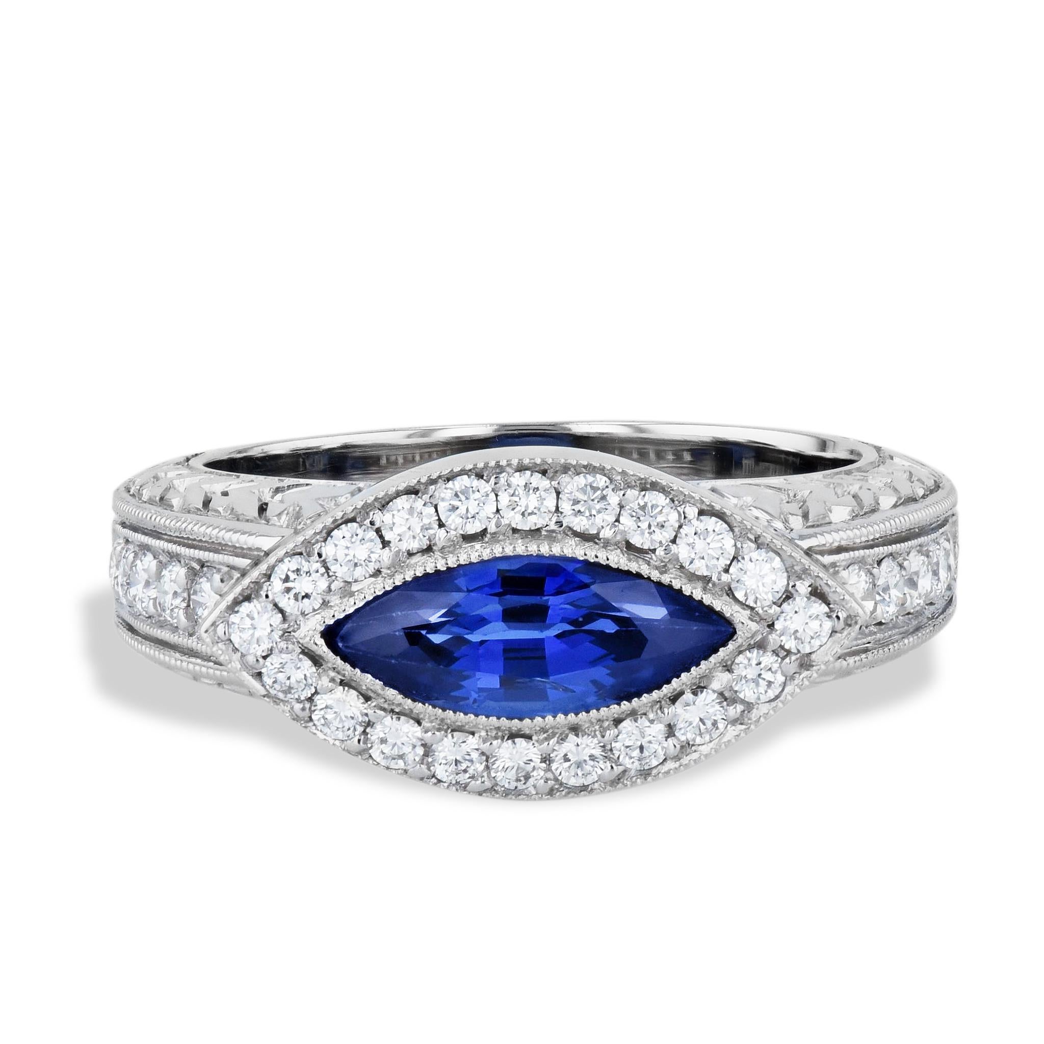 Capture the vintage elegance of our Retro Antique Ring, crafted with Platinum and featuring a brilliant Marquise Cut Blue Sapphire, bezel-set in the center, with round diamond pave set around the sapphire. 
This handmade piece from the HH Collection
