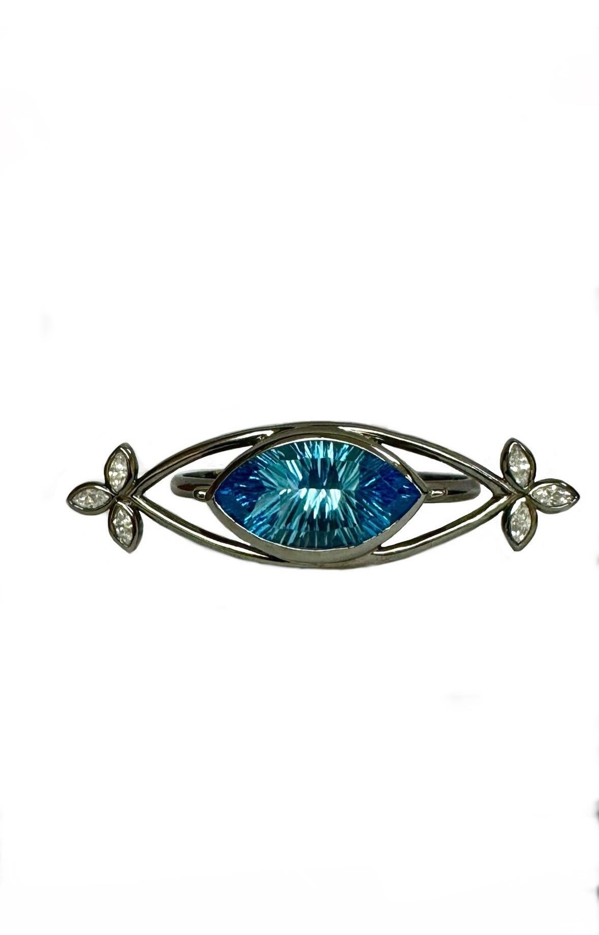 DeKara Design Collection 

Metal- 90% Platinum, 10% Iridium, Black Rhodium.  38.70 Grams.  

Stones- Millennium Cut Marquise Blue Topaz 22 Carats, 6 Marquise Diamonds H-I Color SI3-I1 Clarity 1.20 Carats. 

Size- 7 & 8

One of A Kind Entirely
