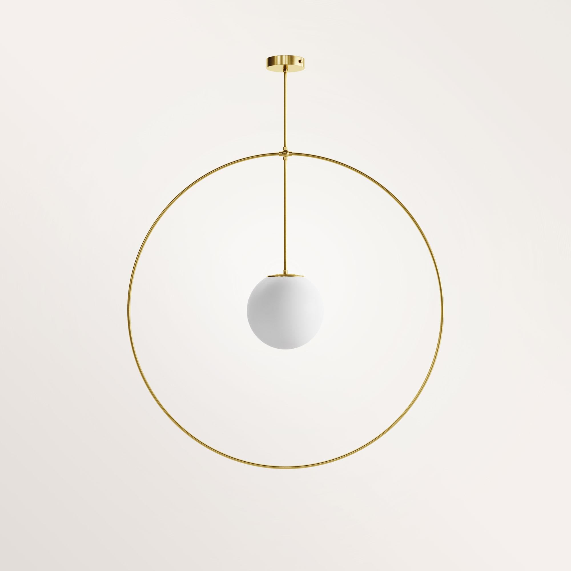 Handmade medium helios chandelier by Gobo Lights
Dimensions: Globe Ø 20 ; Ø 65 ; 100 H 
Materials: Brass, opaline

Goddess with three light heads 

Self-taught and from the world of chemistry, this Belgian craftsman / designer designs his