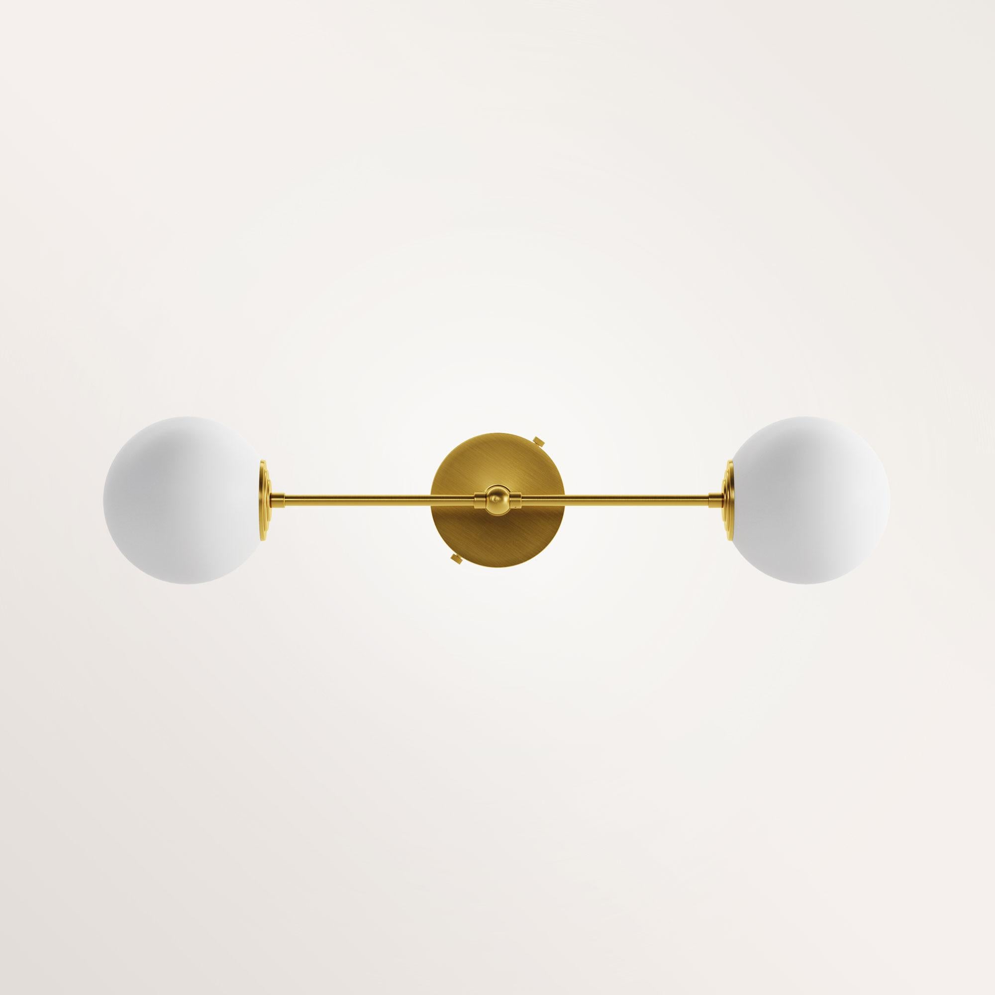 Handmade Medium Janus wall lamp by Gobo Lights
Dimensions: 55 L X 12 l X 15 H
Materials: Brass, Opaline

Goddess with three light heads 

Self-taught and from the world of chemistry, this Belgian craftsman / designer designs his pieces with as