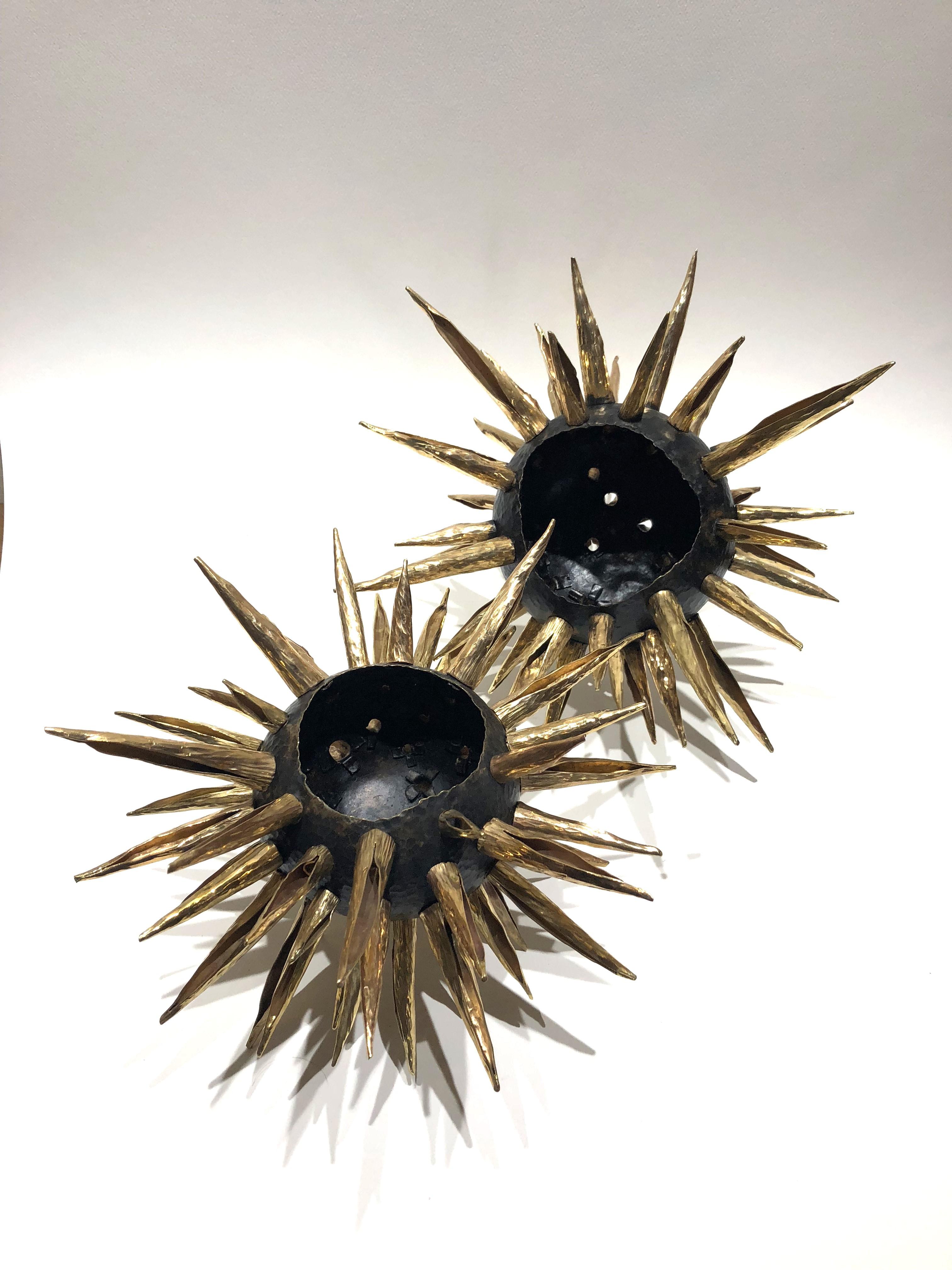 Inspired by the movement and flow of the Sea Urchin, this organic centerpiece is made out of oxidized Tumbaga.

100% hand made by expert craftsmen, each sheet of metal is hand hammered, cut and bent using metal and wood as a last to give each twist