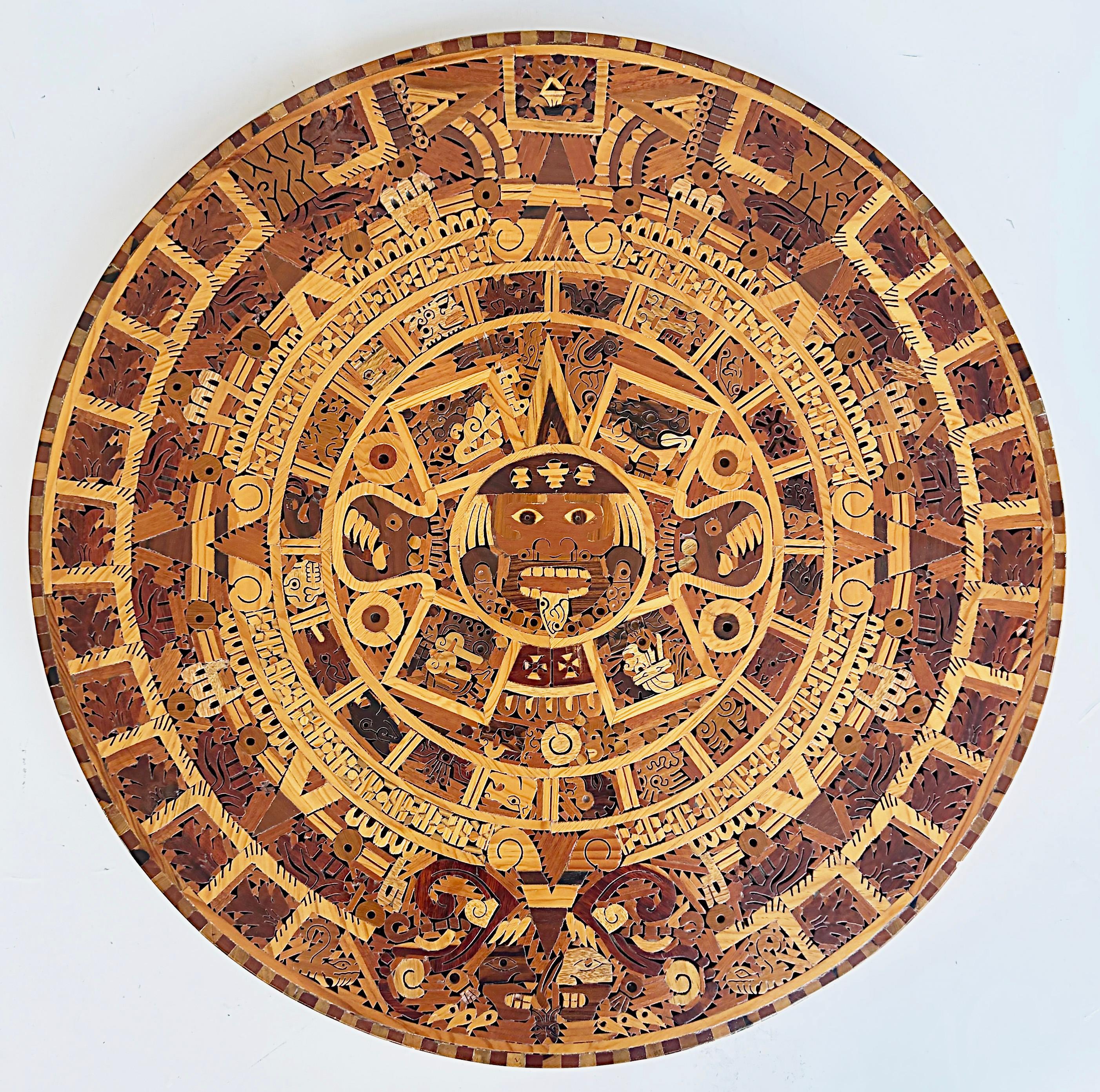 Handmade Mexican Exotic Wood Aztec Calendar Wall Sculpture

Only one is available now.

Offered for sale is an artist-signed handmade tropical exotic hardwood Aztec calendar (Cuauhixalli) sunstone. These intricately made wall sculptures are made