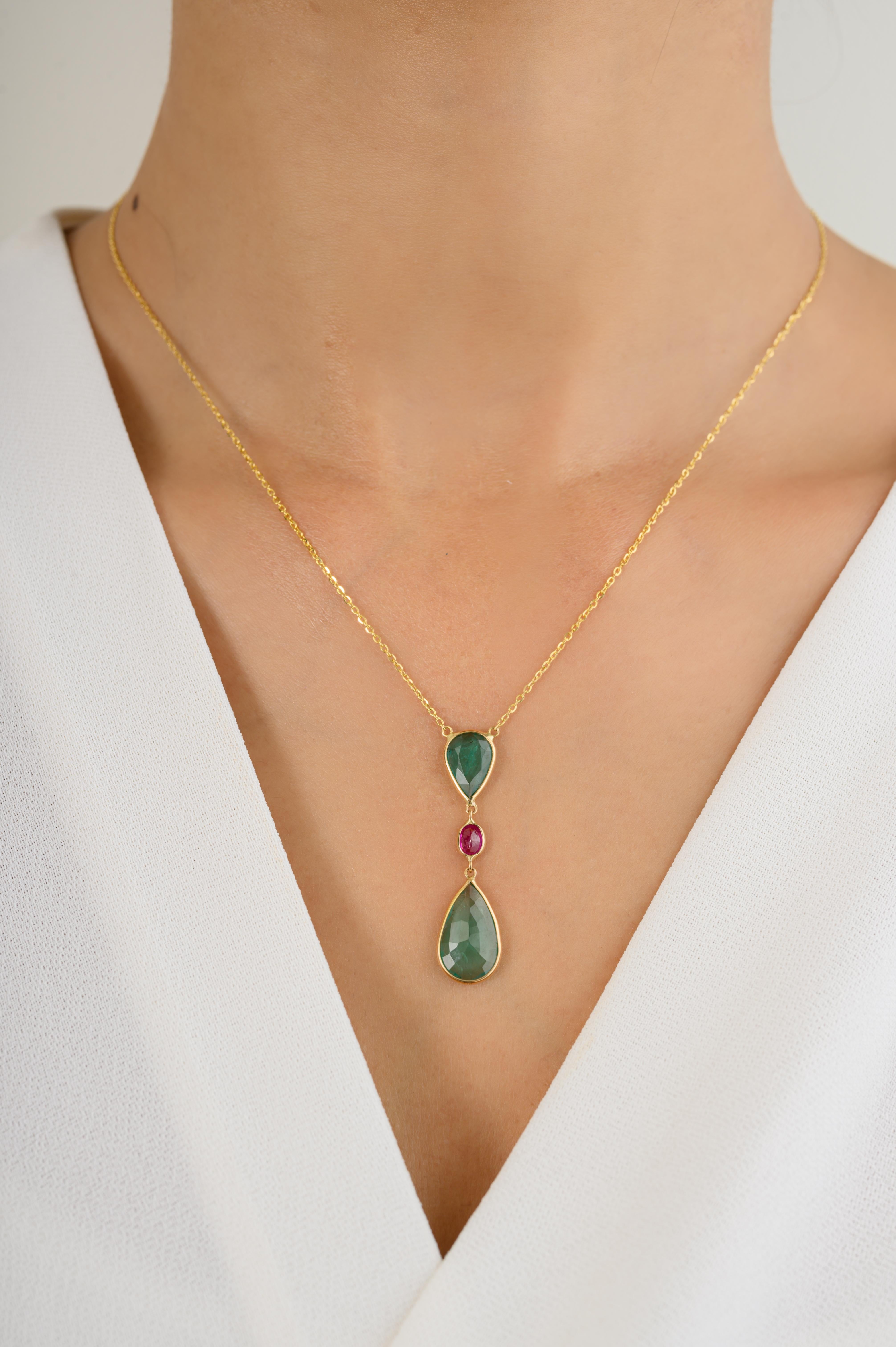 Handmade Minimalist Emerald Ruby Drop Chain Necklace in 18K Gold studded with pear cut emerald and oval cut ruby. This stunning piece of jewelry instantly elevates a casual look or dressy outfit. 
Emerald enhances the intellectual capacity and Ruby