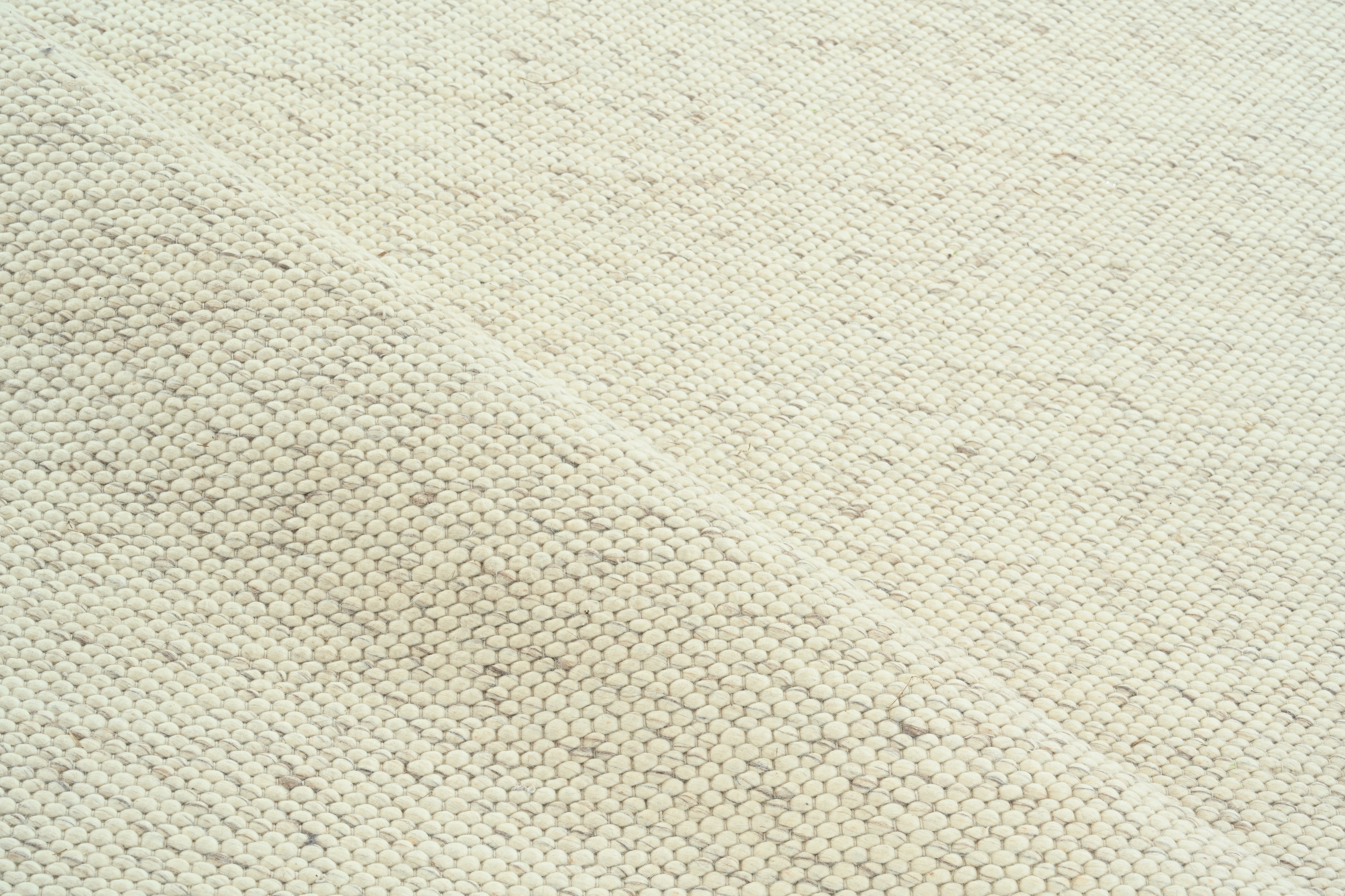 Handmade Minimalist Wool Rug in Ivory and Beige, Contemporary Solid Design For Sale