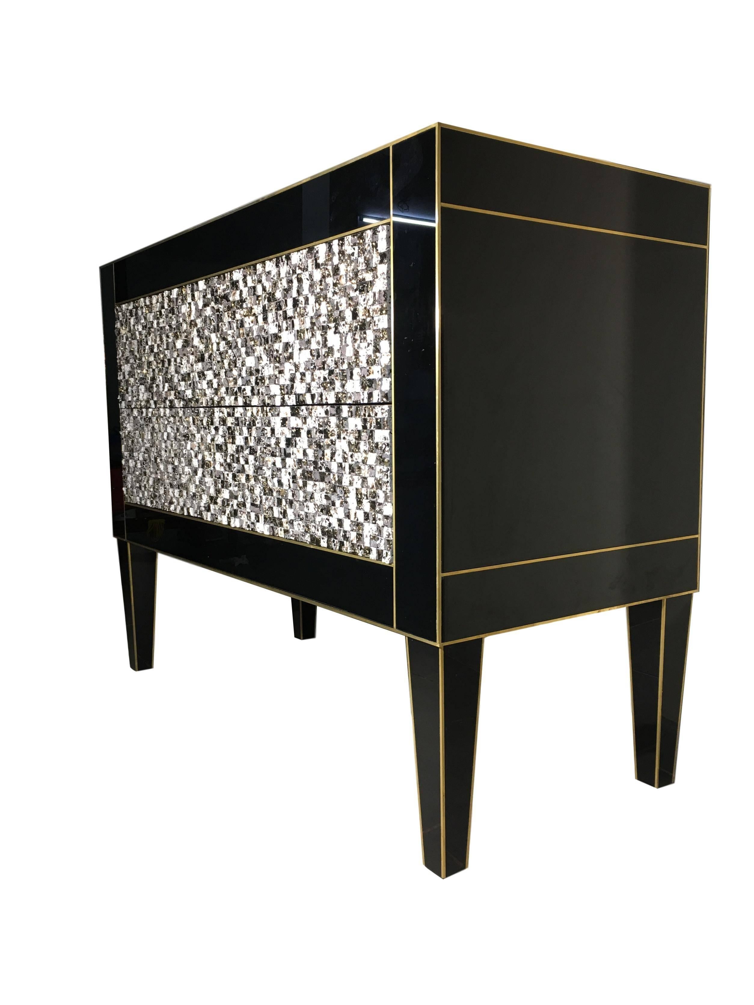 21st century handmade mirrored commode or chest of drawers in Murano glass and brass inlay with two drawers.
The chest are made of wood covered with colored Murano glass panels and push system hardware for open the drawers for more comfort in