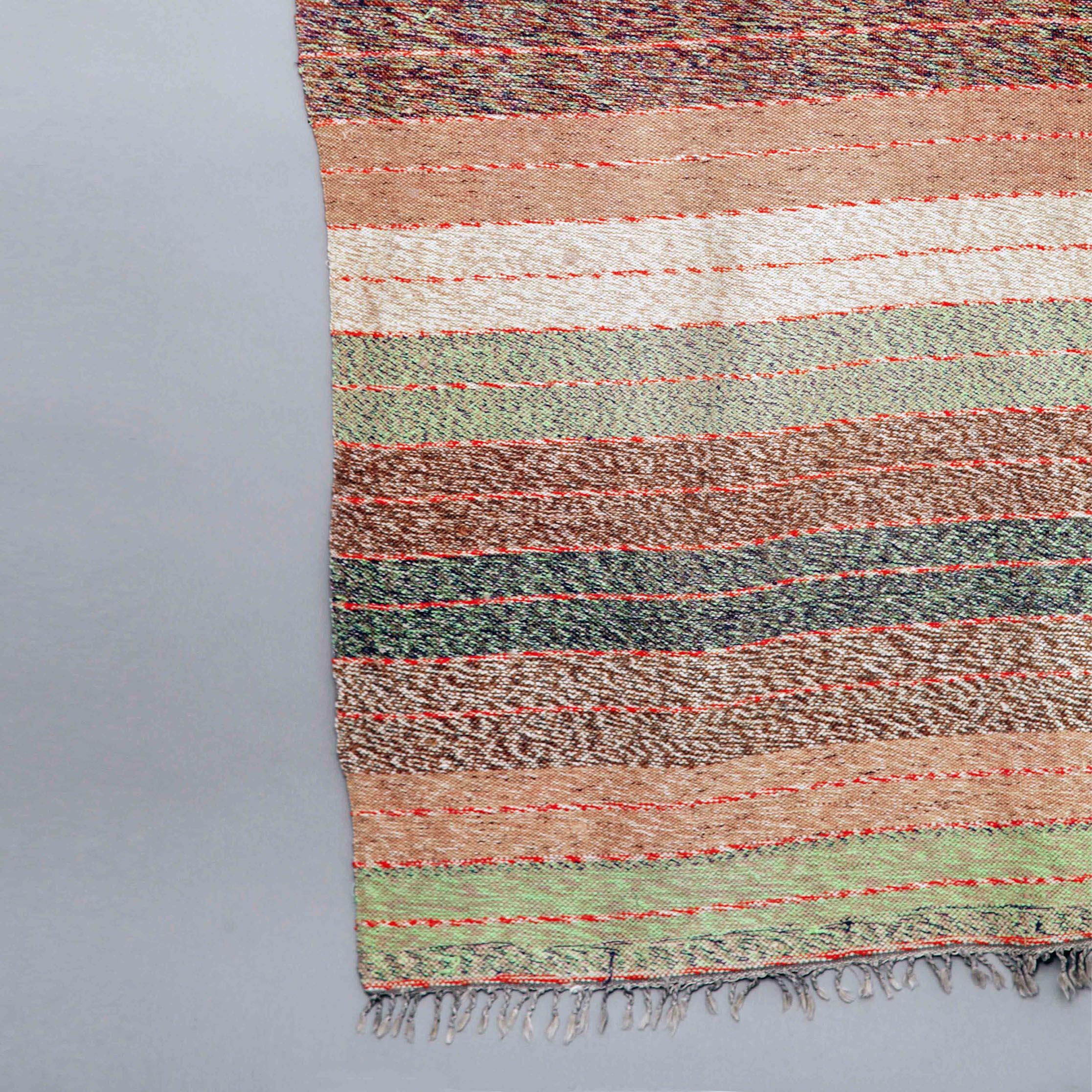 Handmade cotton and wool runner in mixed colored stripes. Imported from Greece and more specifically from the mountainous Taksiyarhi village which was famous for its handmade rug production on looms. The tradition is that young girls have to start