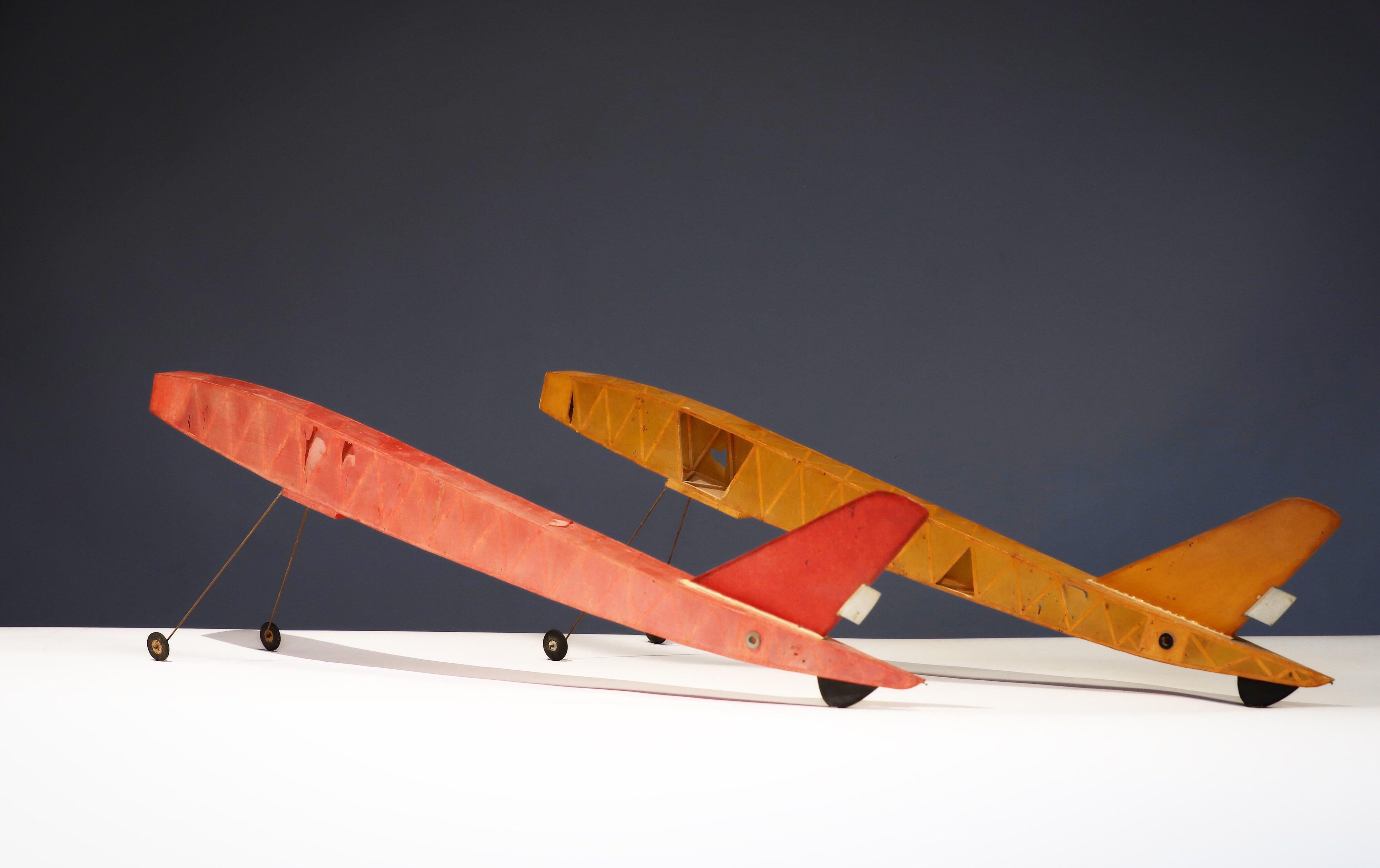 Vintage paper wrapped balsa wood plane bodies. Both with a wonderful aged patina and imperfections. Perfect in a whimsical design, child's room or any serious aviation designed space.
