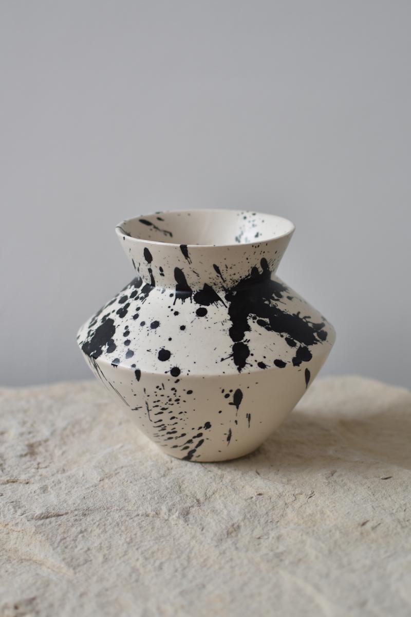 Beautiful decorative ceramic vase, perfect for displaying your favorite blooms. With its simple lines and contemporary aesthetics, this handmade pottery vase crosses the line between functionality and ornament. Use it either as a fully functional