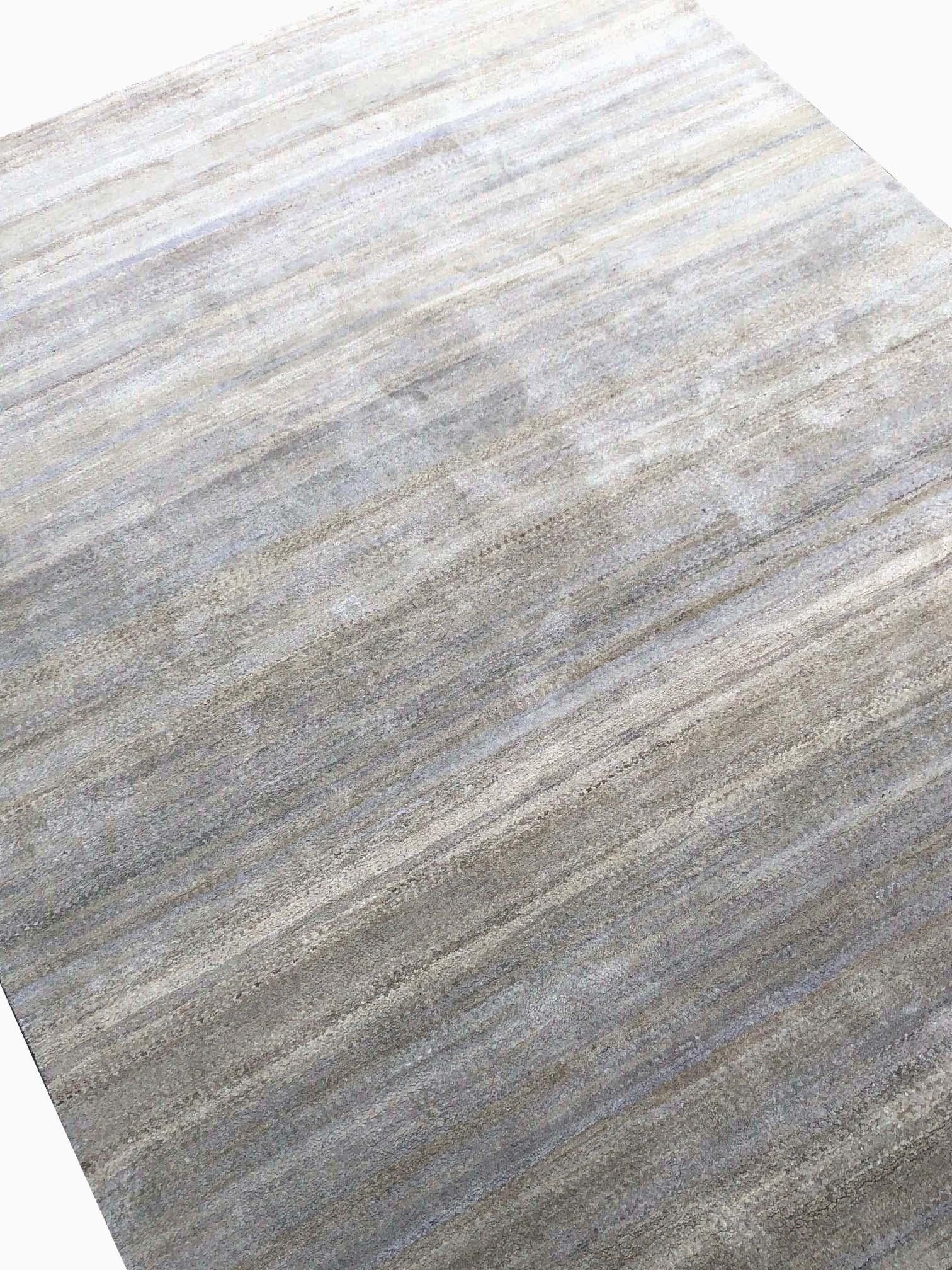 From Rug & Kilim’s Texture of Color Collection, this 8’ x 10’ modern rug is handmade with a proprietary blend of quality silk in this innovation of plain rug styles and comfortable versatility. The natural sheen quality of the silk blend plays very