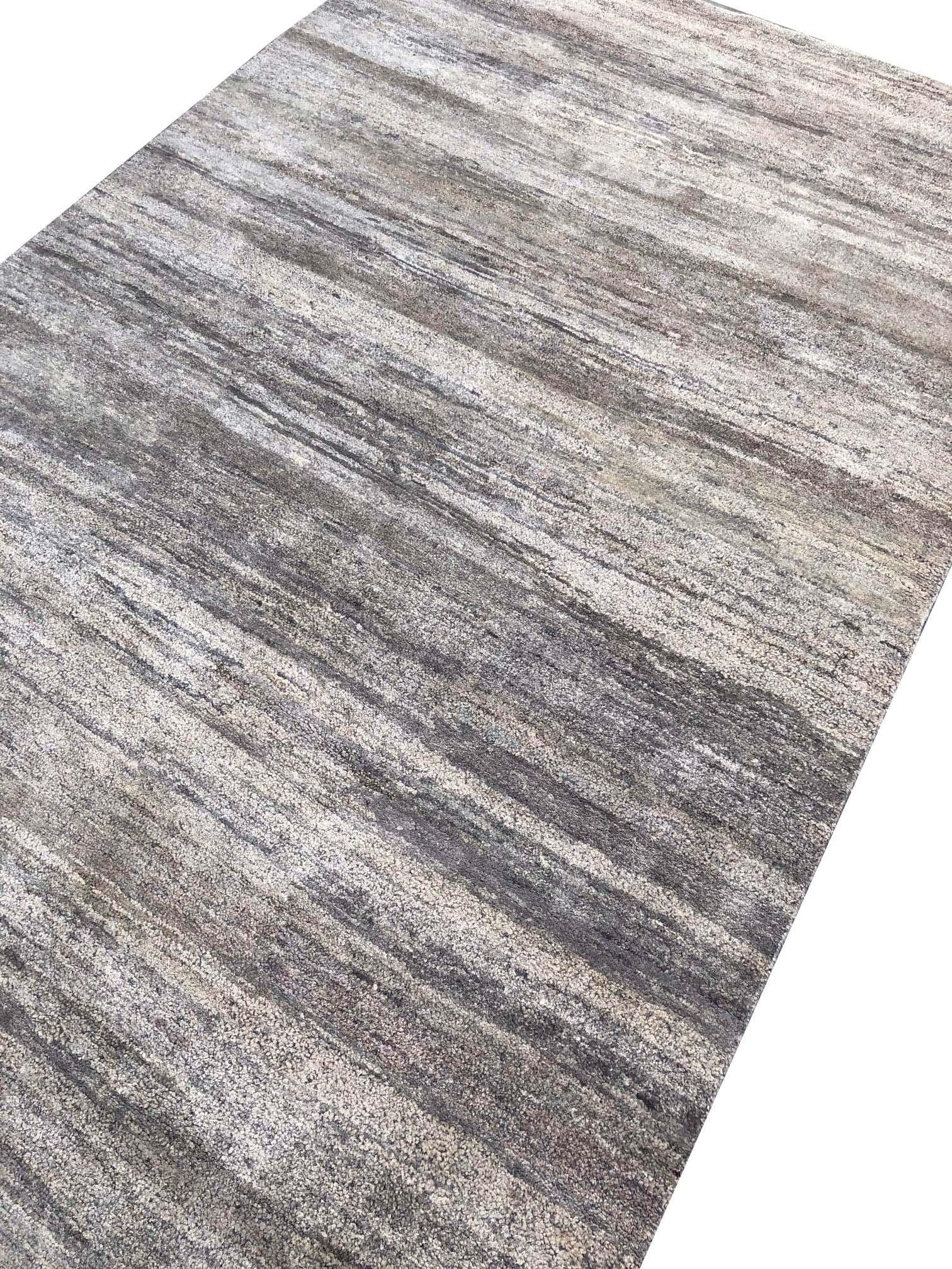From Rug & Kilim’s texture of color collection, this 5’ x 8’ modern rug is handmade with a proprietary blend of quality silk in this innovation of plain rug styles and comfortable versatility. The natural sheen quality of the silk blend plays very