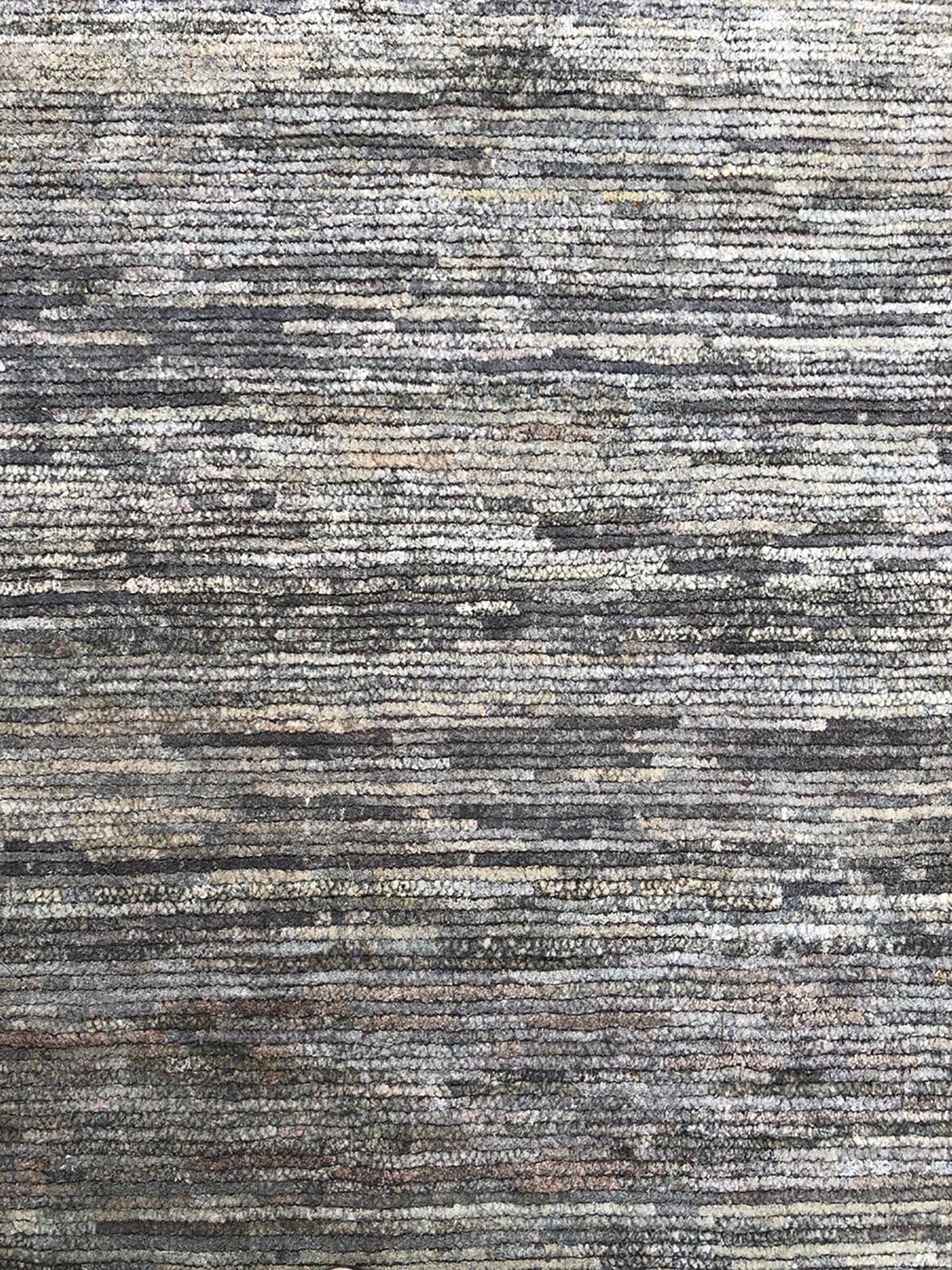 From Rug & Kilim’s Texture of Color Collection, this 6’ x 9’ modern rug is handmade with a proprietary blend of quality silk in this innovation of plain rug styles and comfortable versatility. The natural sheen quality of the silk blend plays very