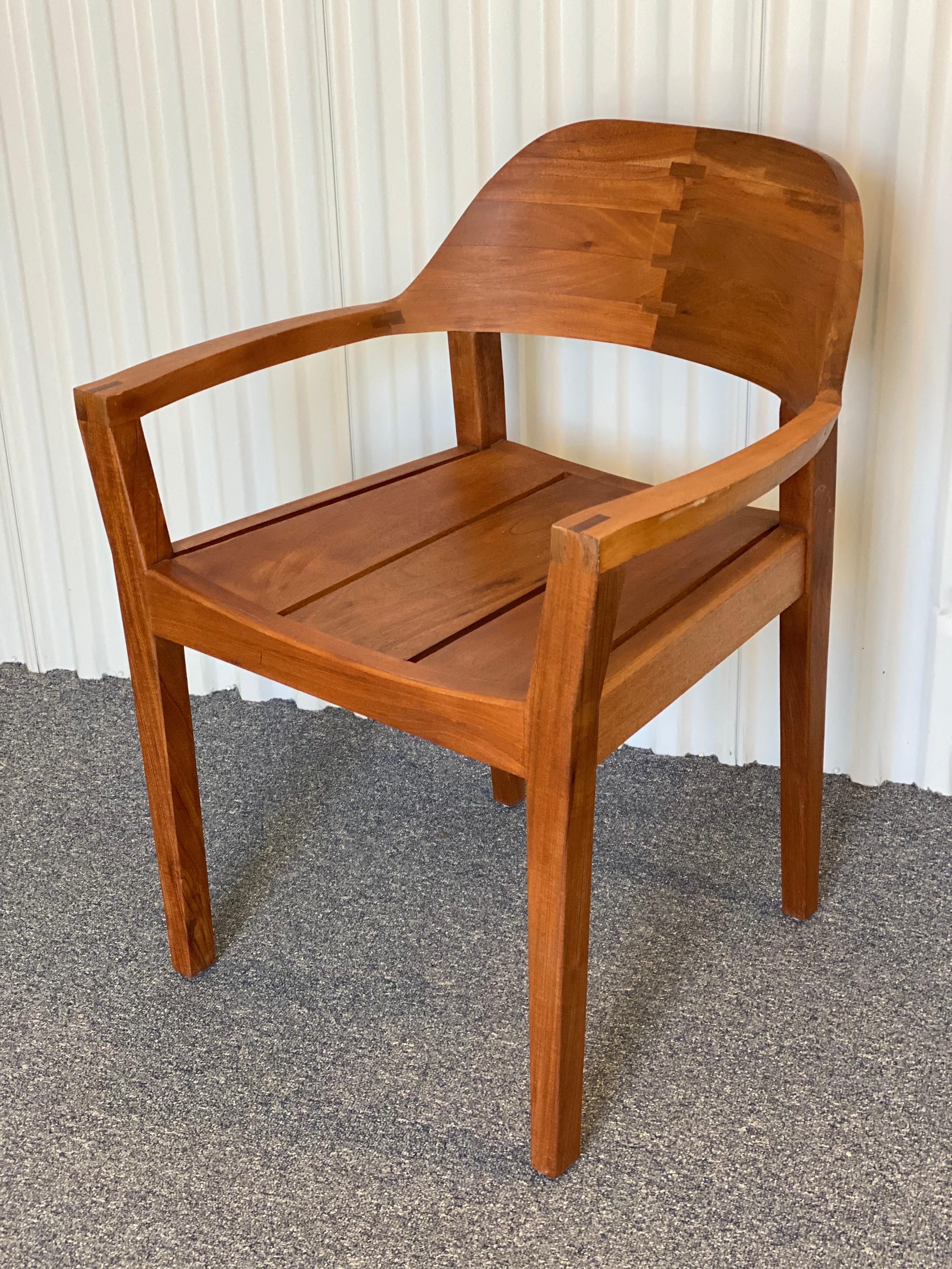 Handmade modern style Royal mahogany srmchair.
Made in Nicaragua out of local wood, Cedro Macho or Royal mahogany wood. Some scratches to finish. Really well made, solid chair with interesting design details.

Measures: 33