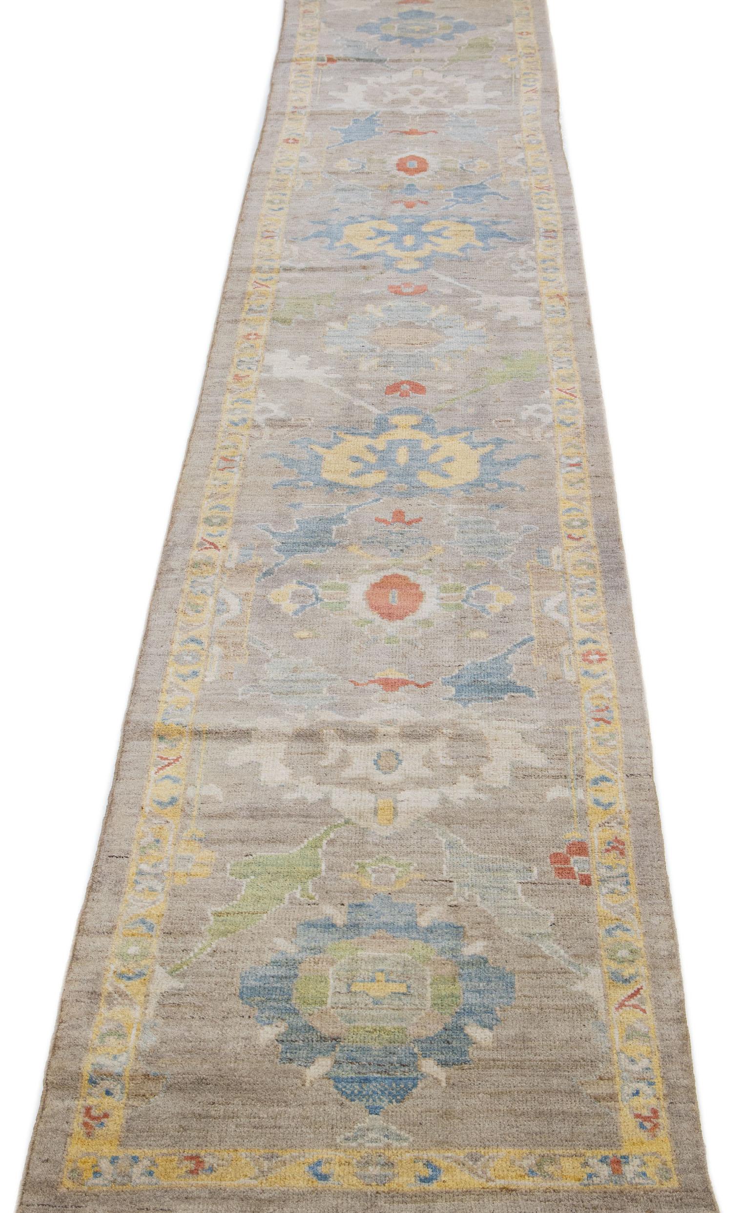 Beautiful modern Sultanabad hand-knotted wool rug with a tan color field. This rug has a designed frame with multicolor accents in a gorgeous all-over floral design.

This rug measures: 2'8