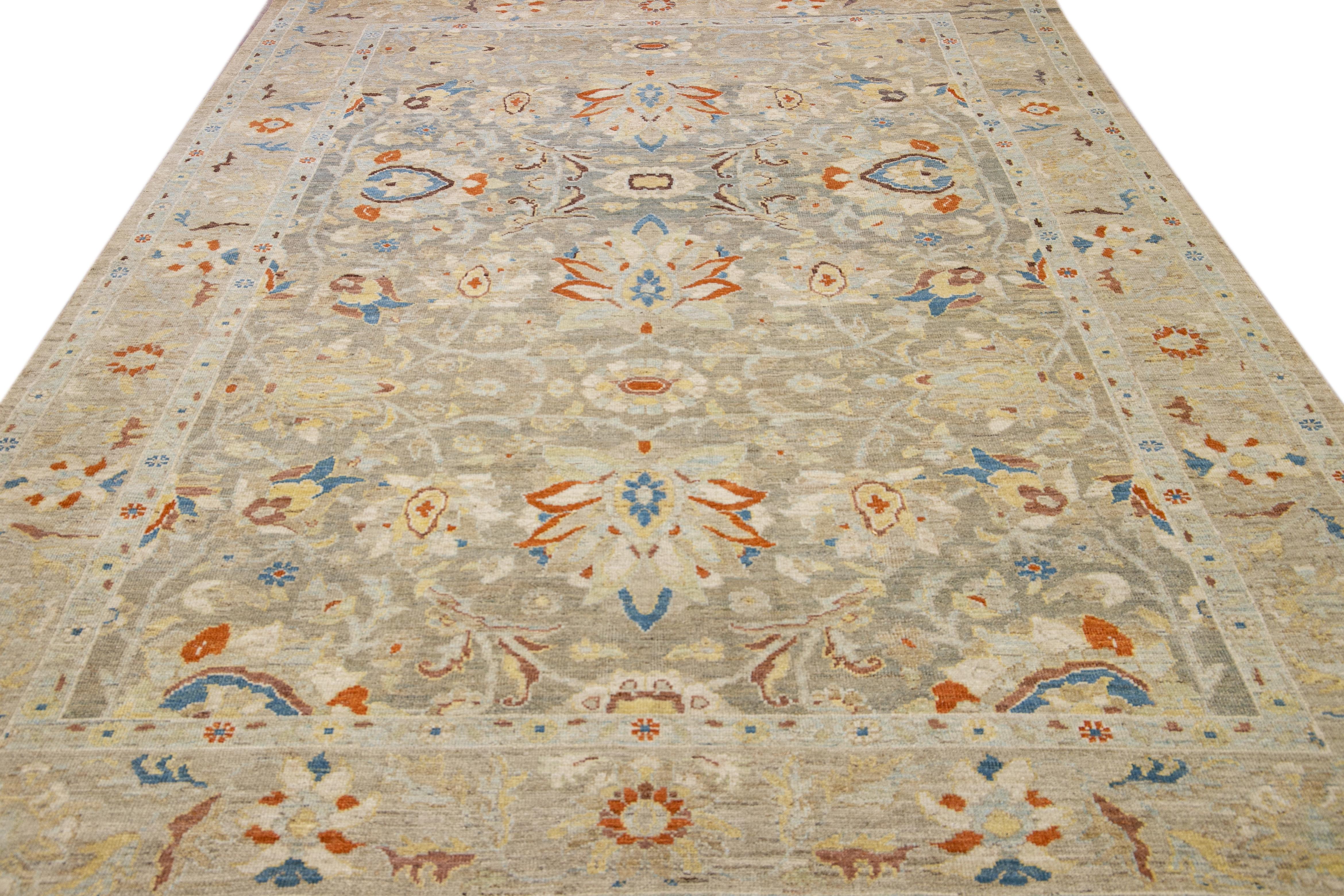 This hand-knotted wool rug highlights a modern take on the timeless Sultanabad design. It boasts a breathtaking light gray shade that radiates charm and elegance. The mesmerizing floral embroidery, featuring a range of vibrant colors, is beautifully