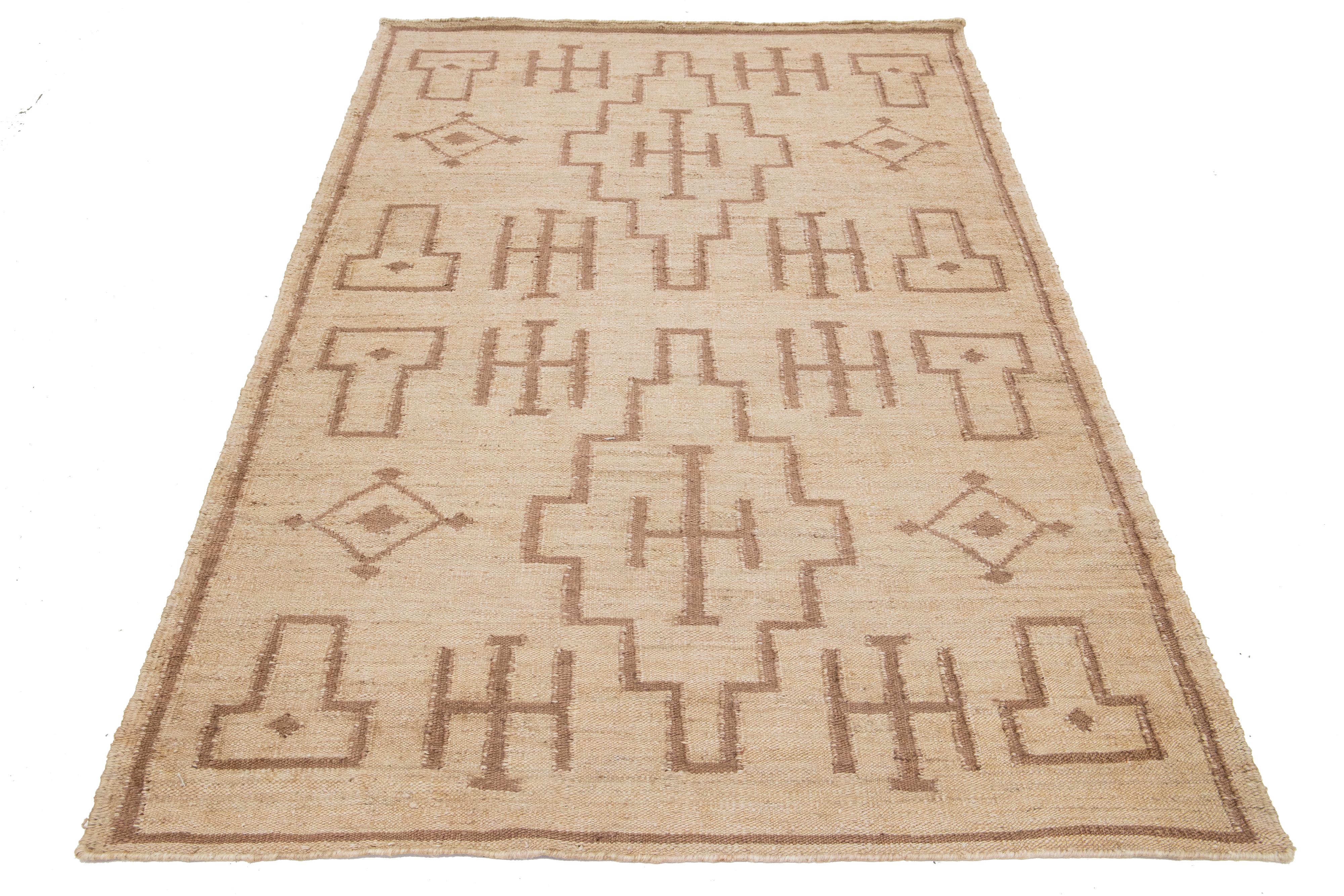 Modern Dhurrie Natural Jute Rug. 

This rug measures 5'2'' x 8'3