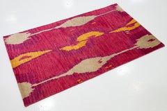 Alfombra moderna hecha a mano de lana tibetana con diseño abstracto en rosa