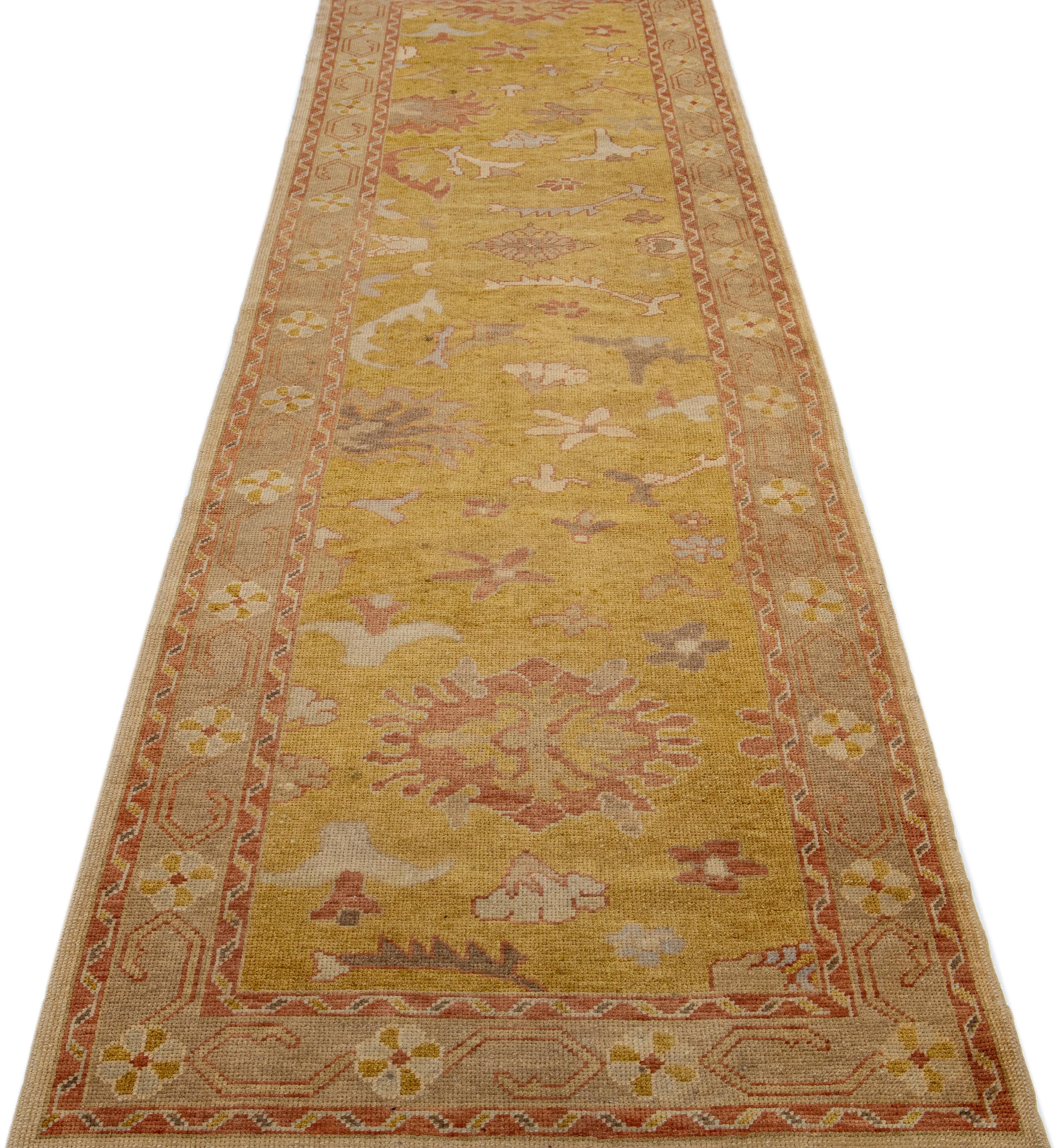 Beautiful Modern Turkish hand-knotted wool rug with a goldenrod color field. This rug has a gray designed frame with accent colors of rust and yellow in a gorgeous all-over geometric floral design.

This rug measures: 3'6