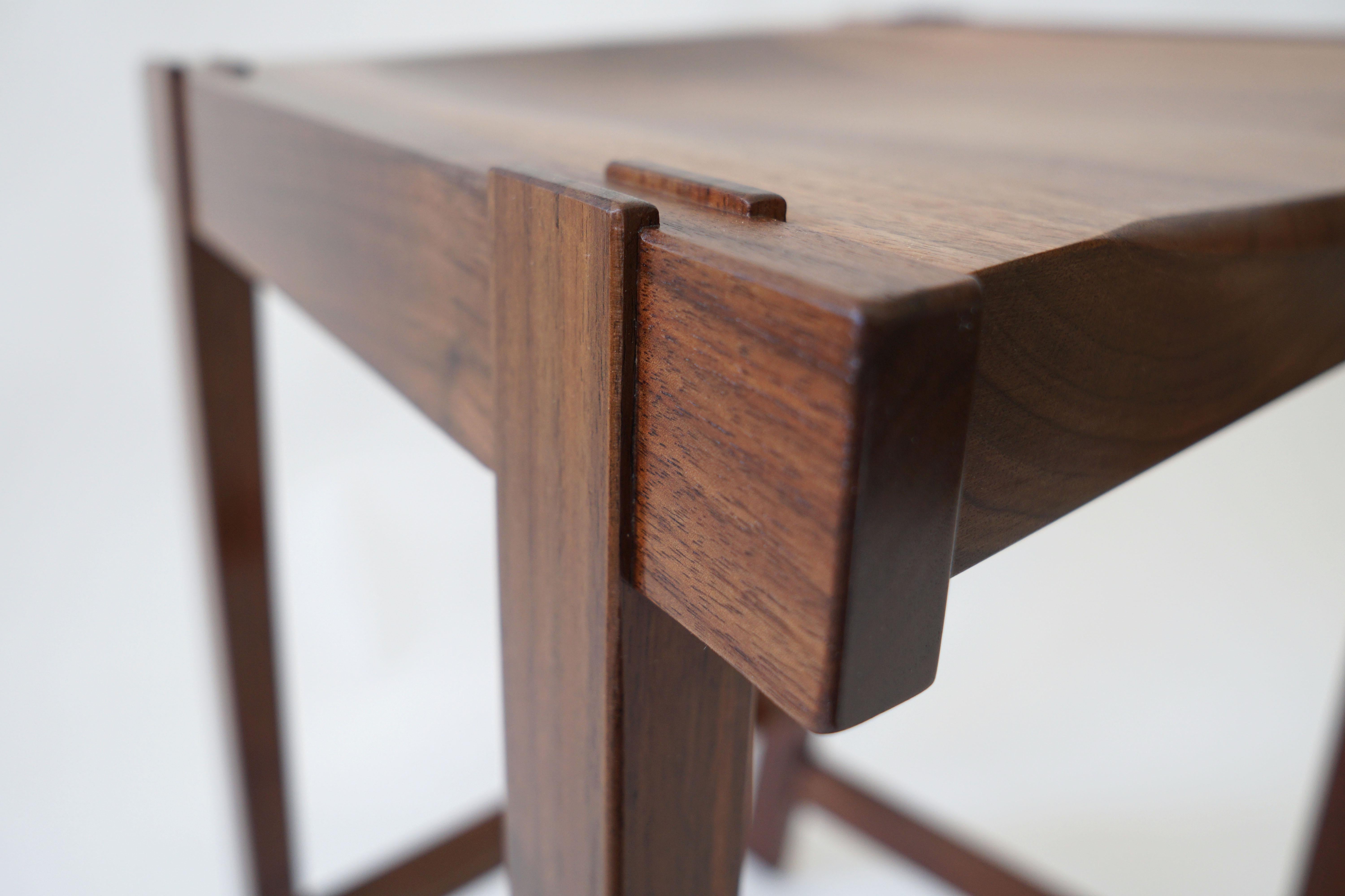 Scandinavian Modern Montrose Stool in Walnut, Exposed Joinery with a Hand Carved Seat For Sale