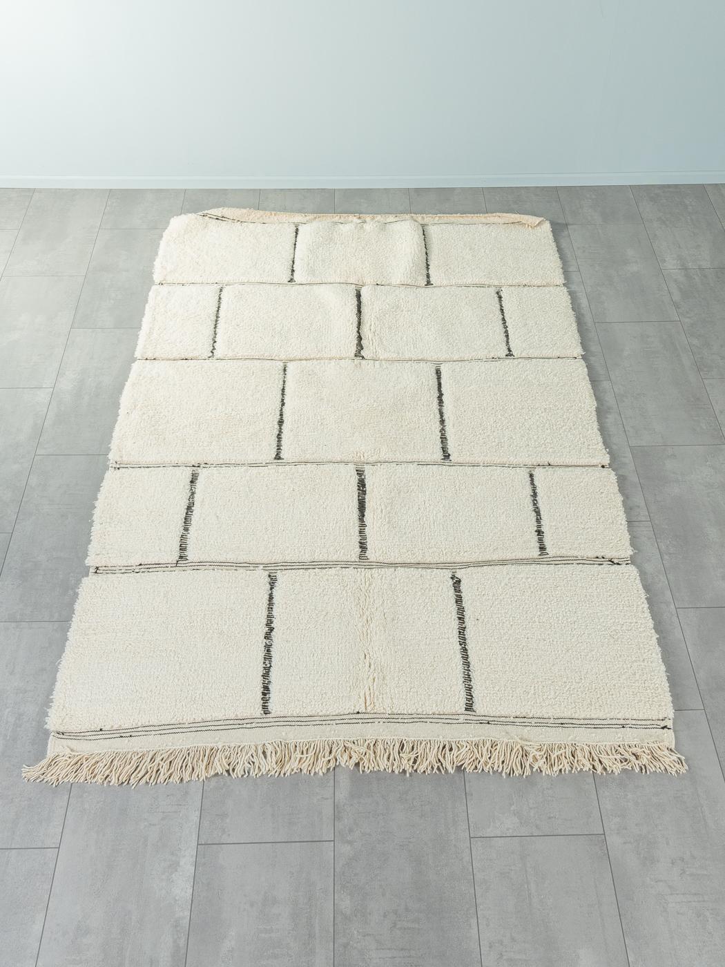 Constancy is a contemporary 100% wool rug – thick and soft, comfortable underfoot. Our Berber rugs are handwoven and handknotted by Amazigh women in the Atlas Mountains. These communities have been crafting rugs for thousands of years. One knot at a
