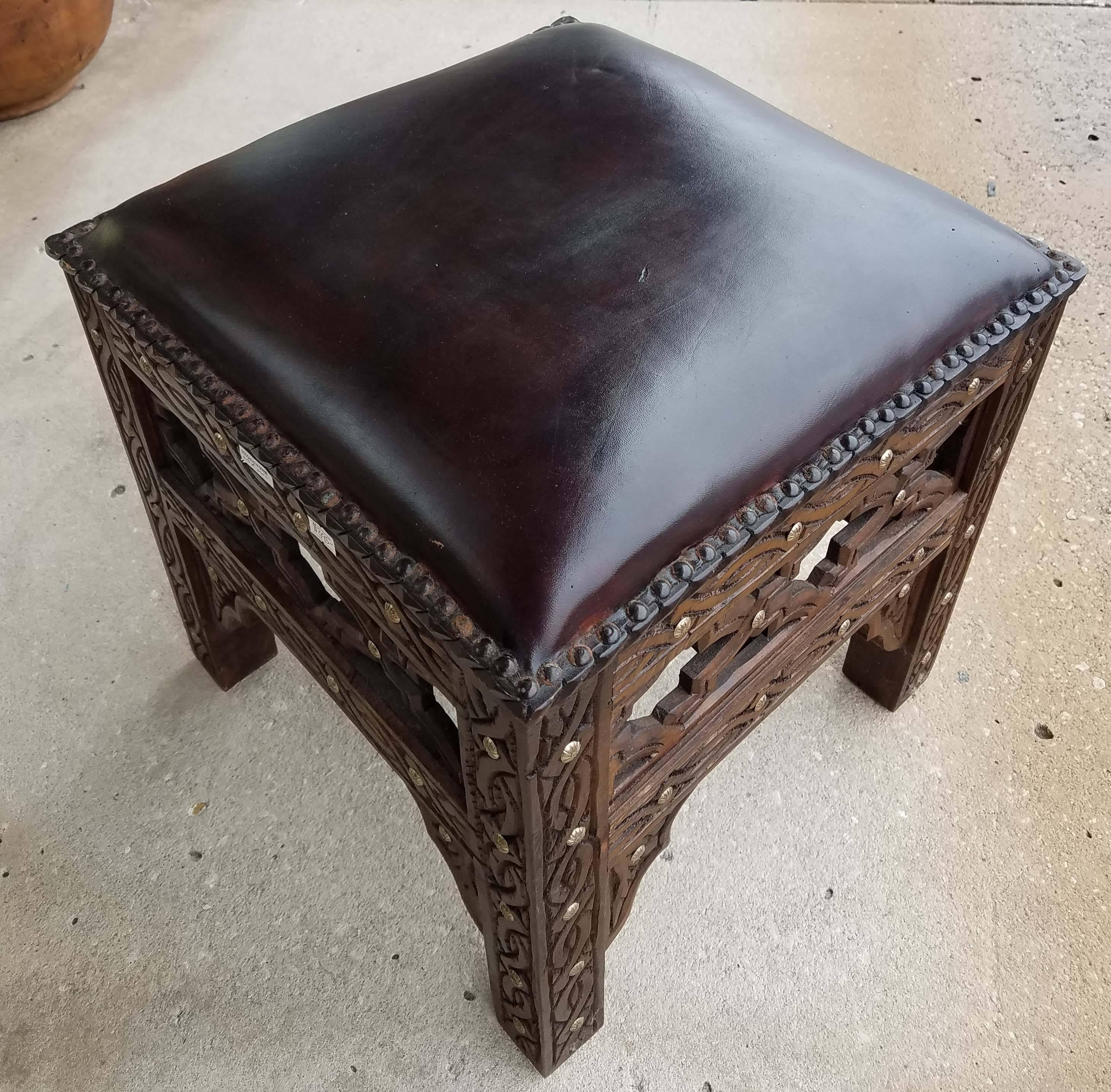 An amazing stool idea and a great alternative to Poufs and ottomans. The perfect foot stool!
Handmade Moroccan wooden stool with genuine leather cushion and carved cedar wood base, measuring approximately 16