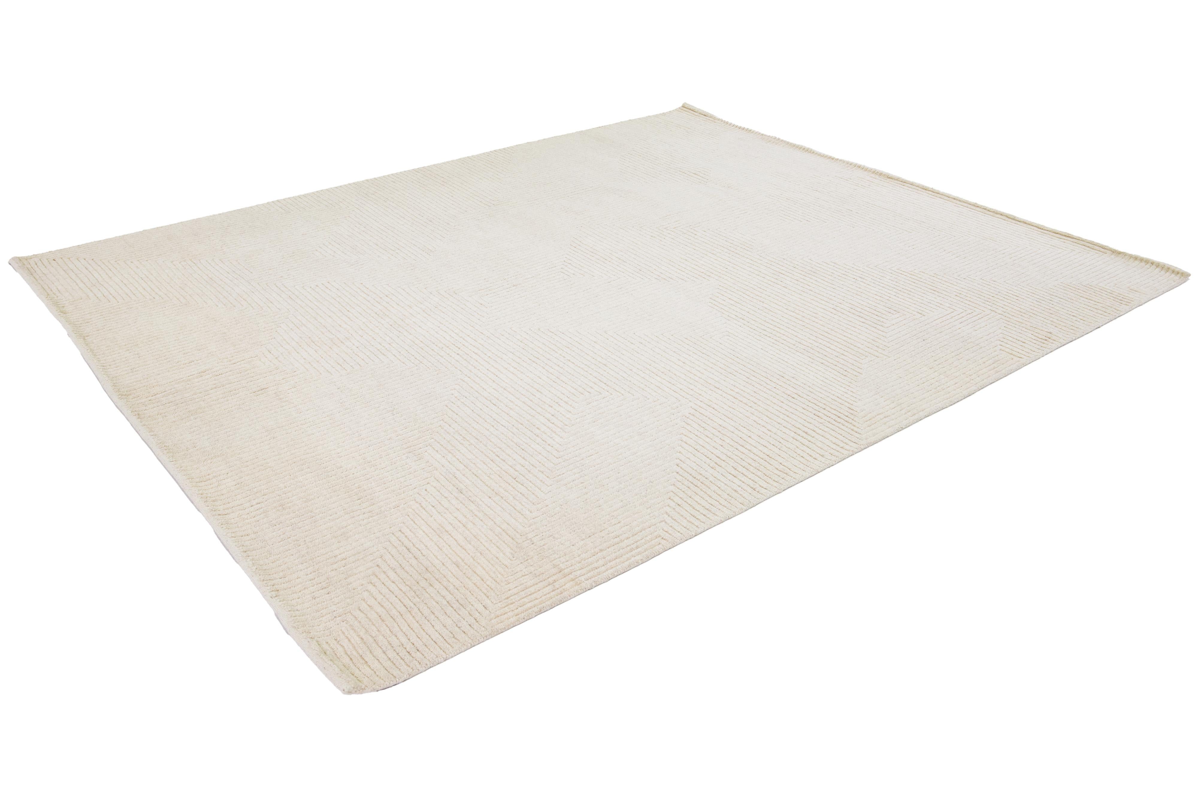 Contemporary Handmade Moroccan Style Beige Wool Rug With Minimalist Design For Sale